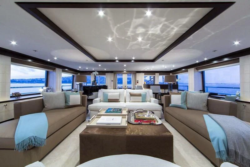a living room with a couch and a table aboard REVELRY Yacht for Sale