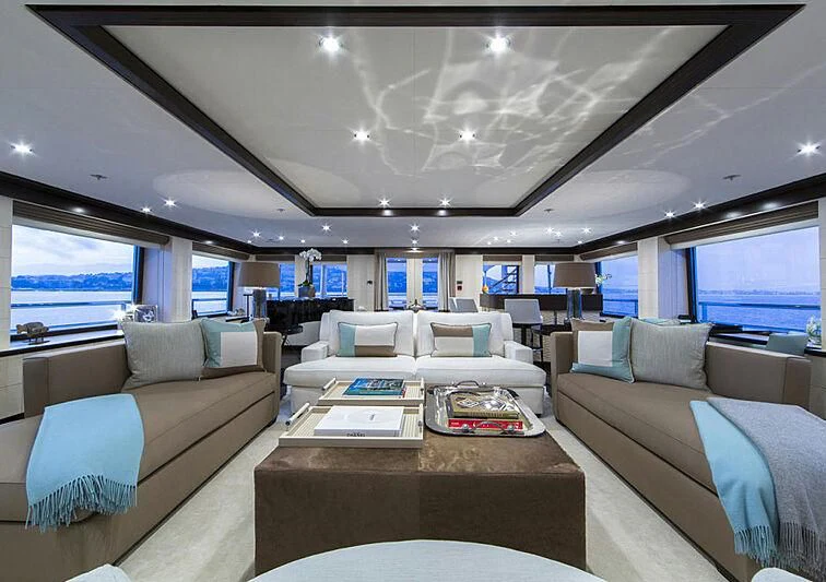 a living room with a couch and a table aboard REVELRY Yacht for Sale