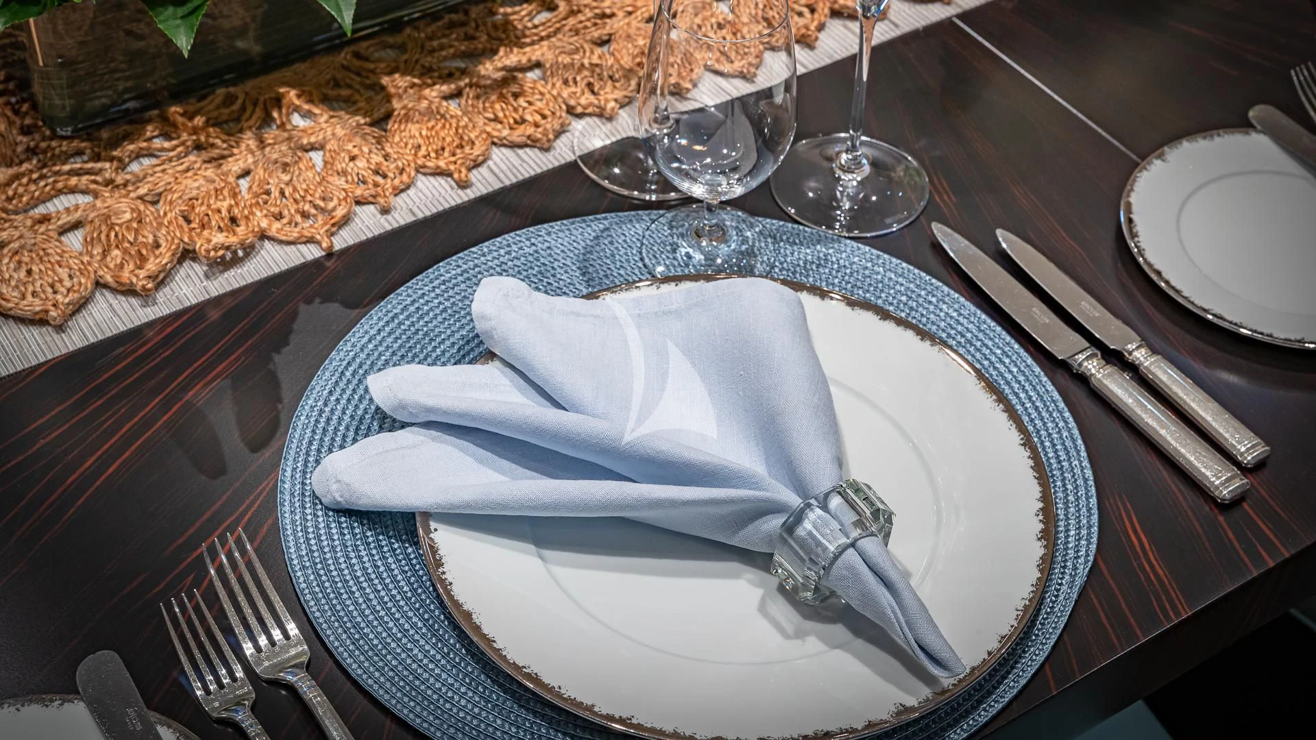 a plate with a napkin and silverware on it aboard REVELRY Yacht for Sale