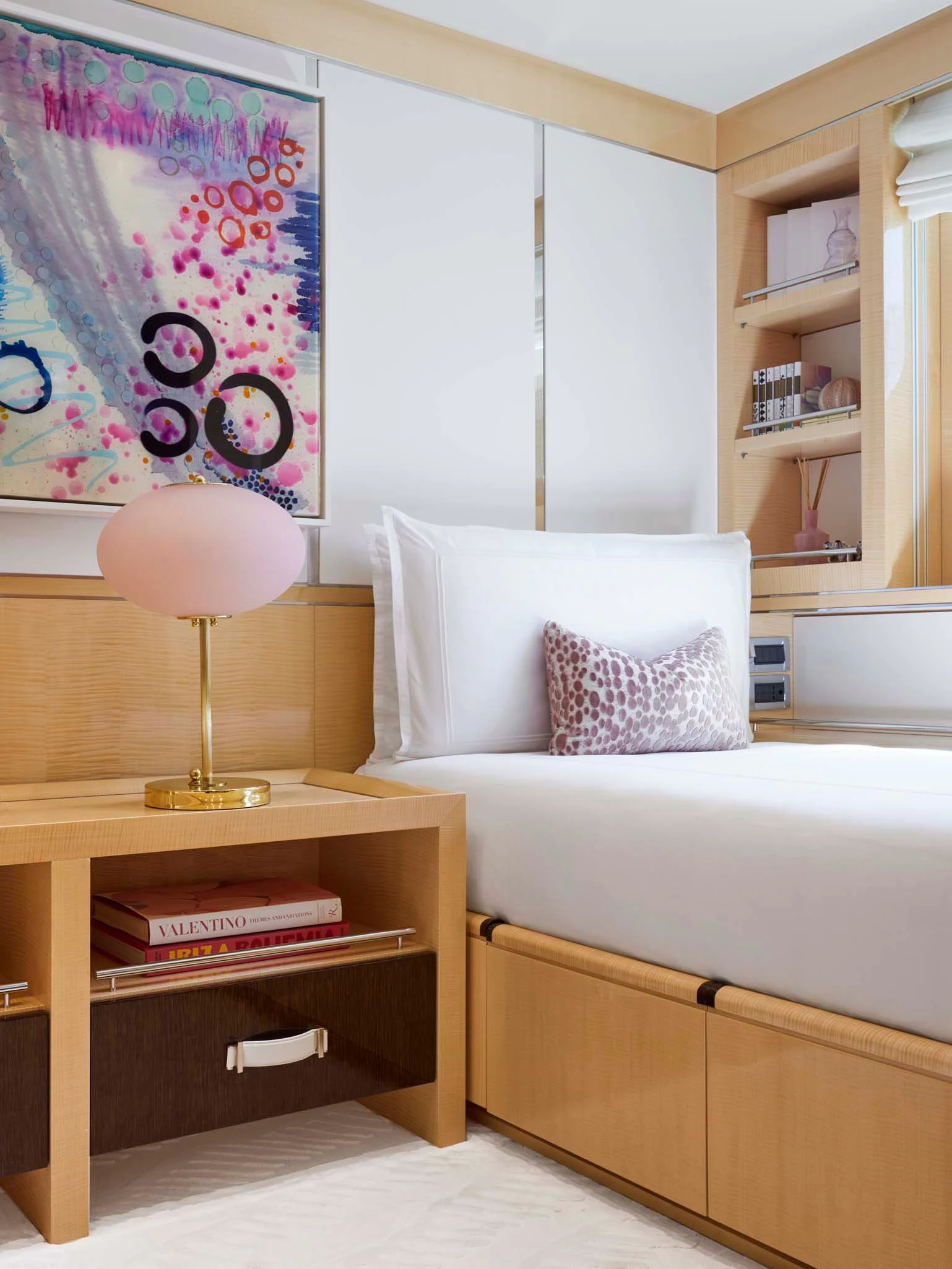 a bedroom with a bed and a desk aboard REVELRY Yacht for Sale