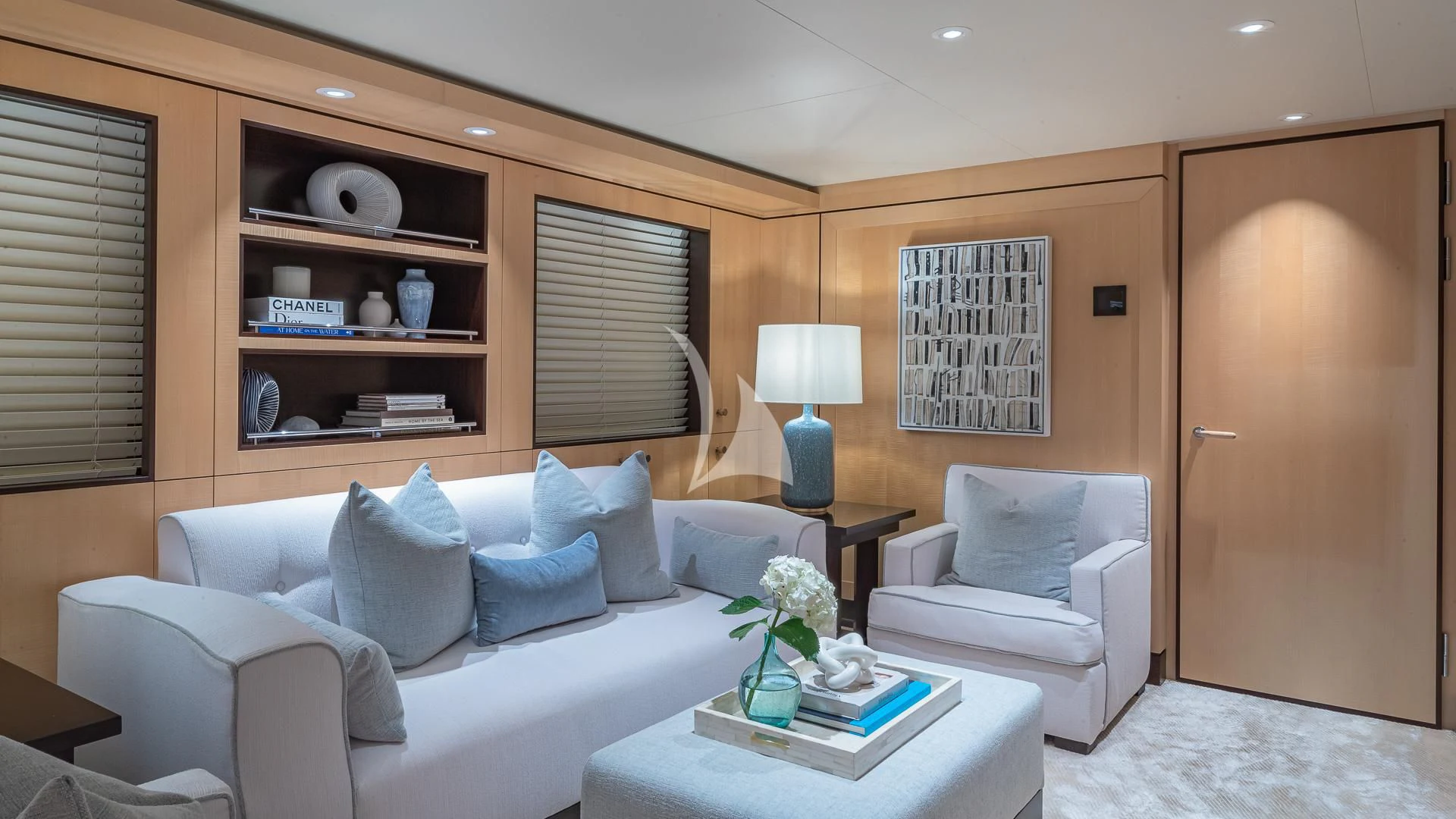 a living room with a white couch and a coffee table aboard REVELRY Yacht for Sale