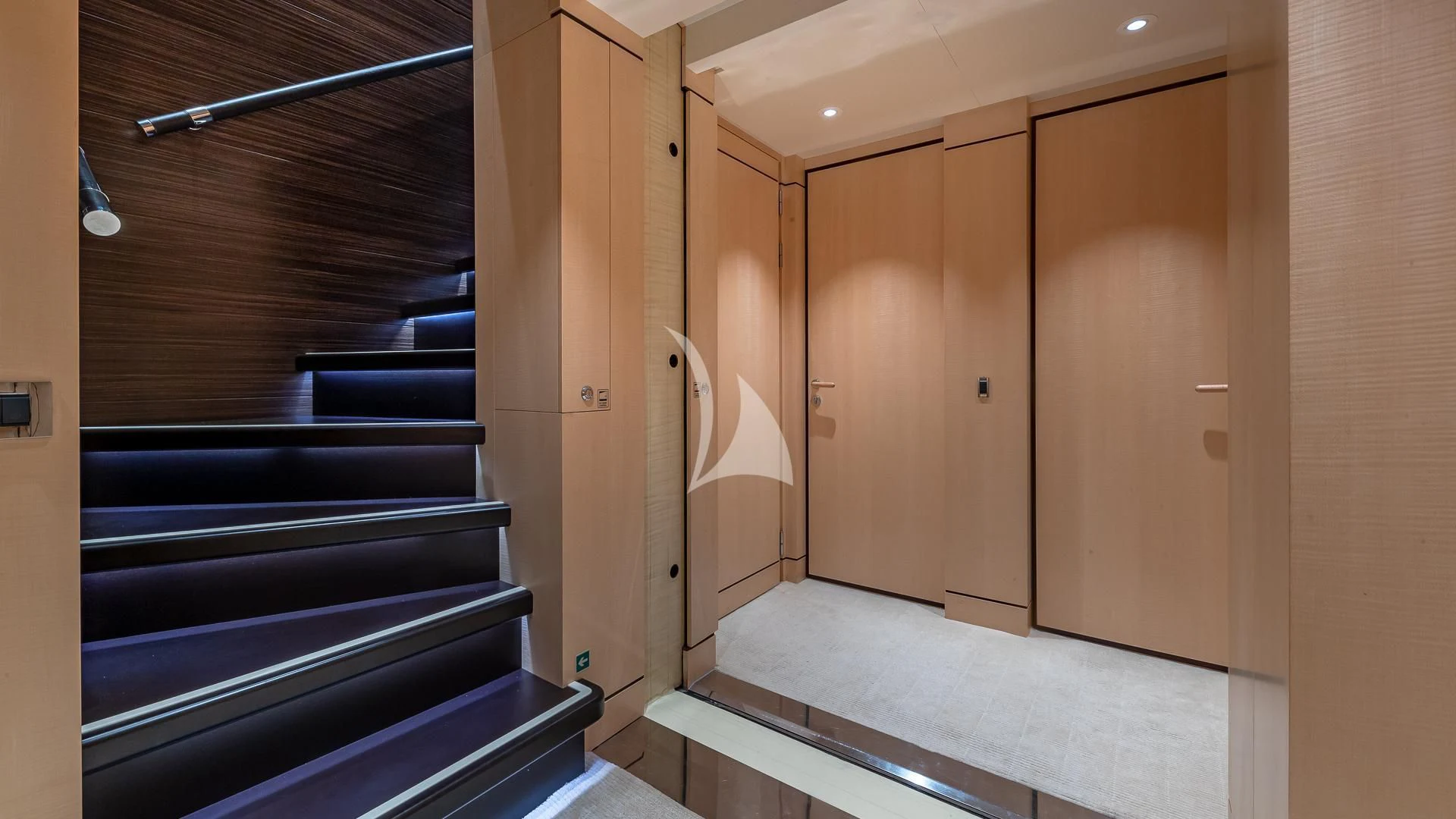 a room with wooden doors aboard REVELRY Yacht for Sale