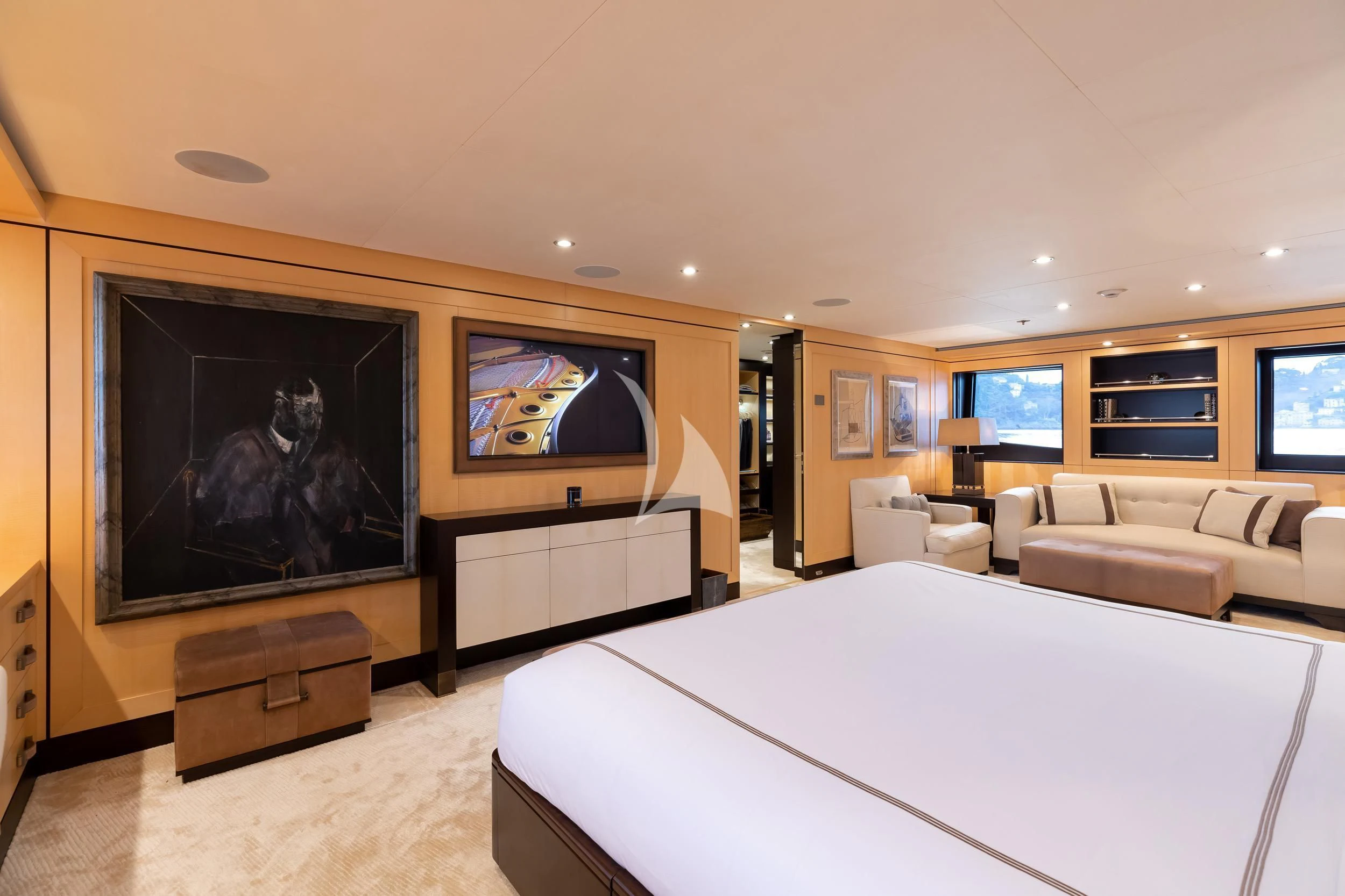 a large hotel room with a large television on the wall aboard REVELRY Yacht for Sale