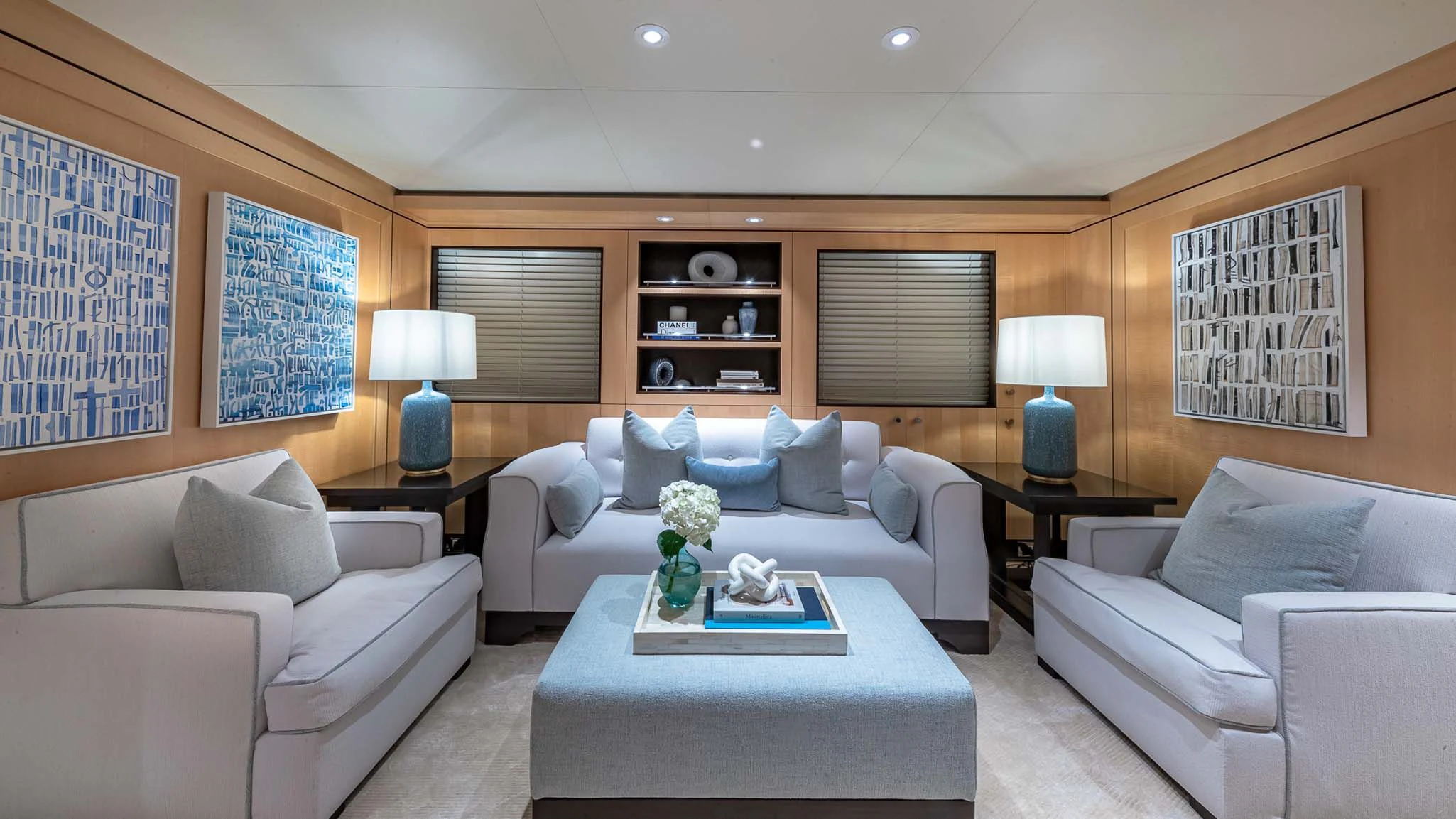 a living room with a couch and a coffee table aboard REVELRY Yacht for Sale