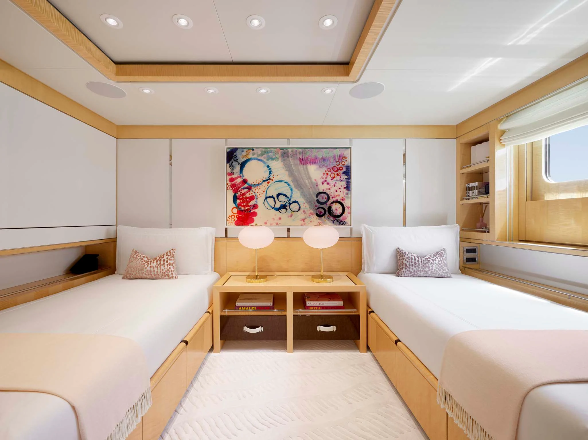 a room with a couple of beds aboard REVELRY Yacht for Sale