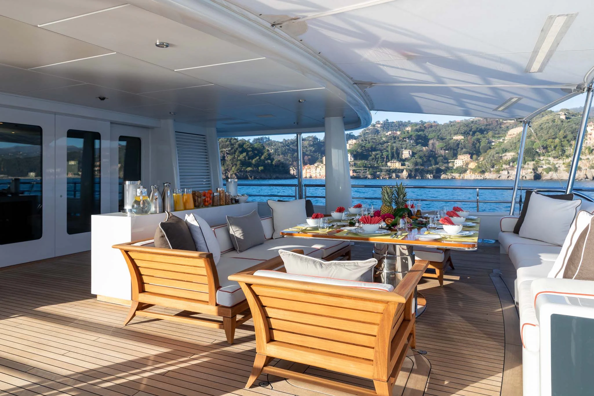 a living room with a large balcony aboard REVELRY Yacht for Sale