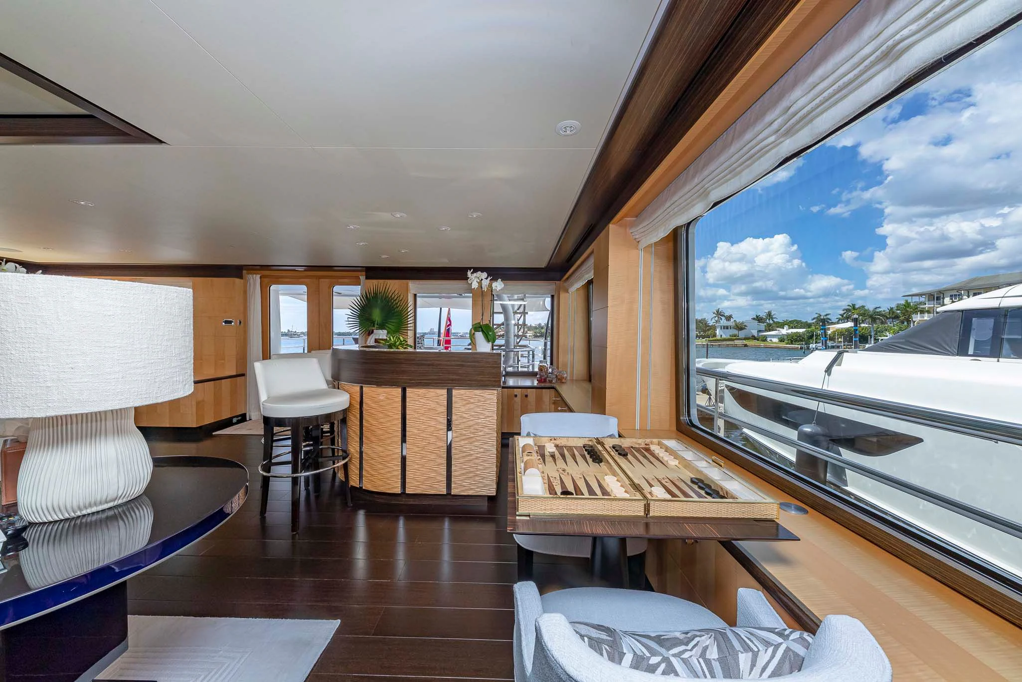 a room with a table and chairs aboard REVELRY Yacht for Sale