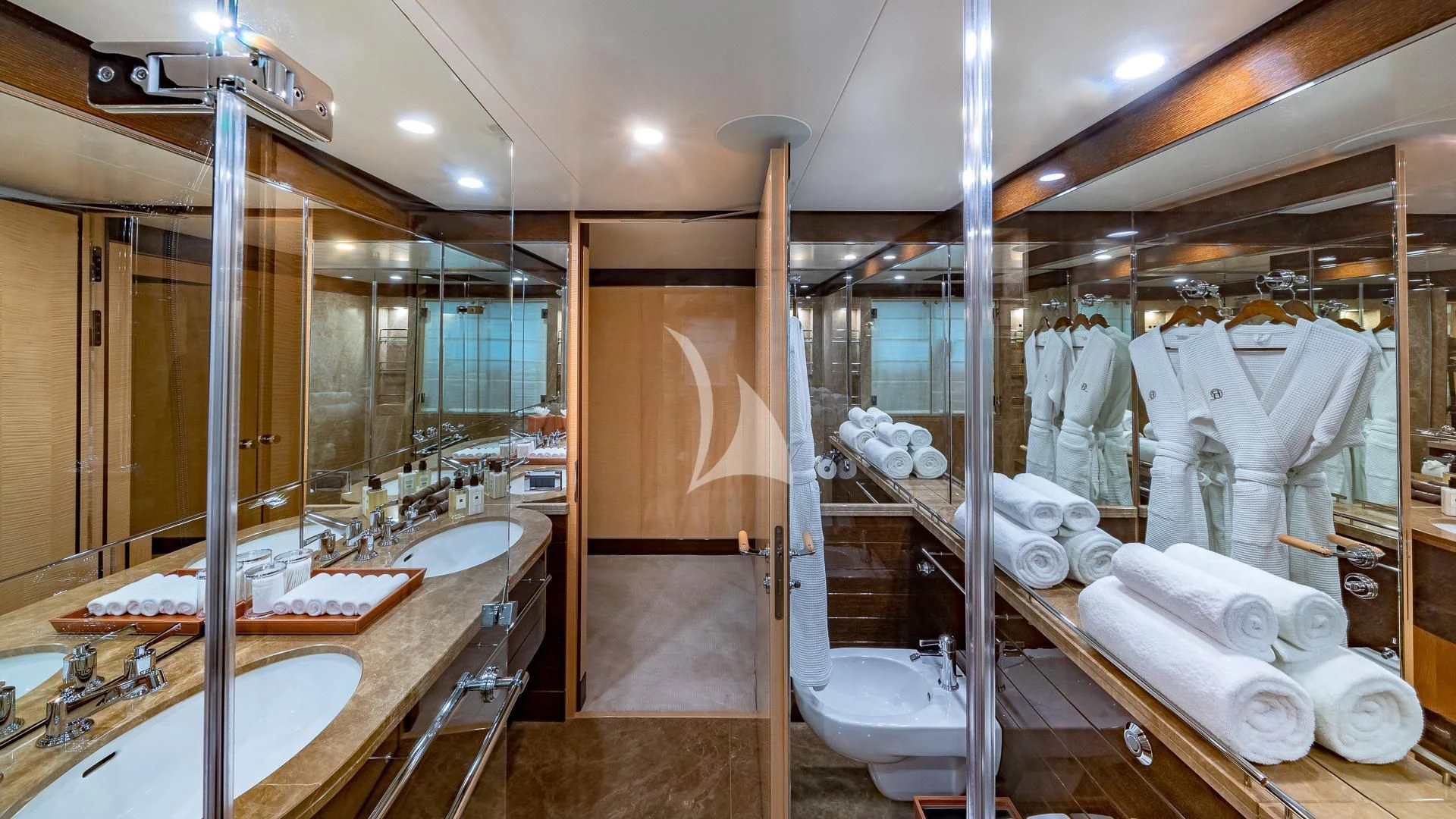 a bathroom with a large mirror aboard REVELRY Yacht for Sale