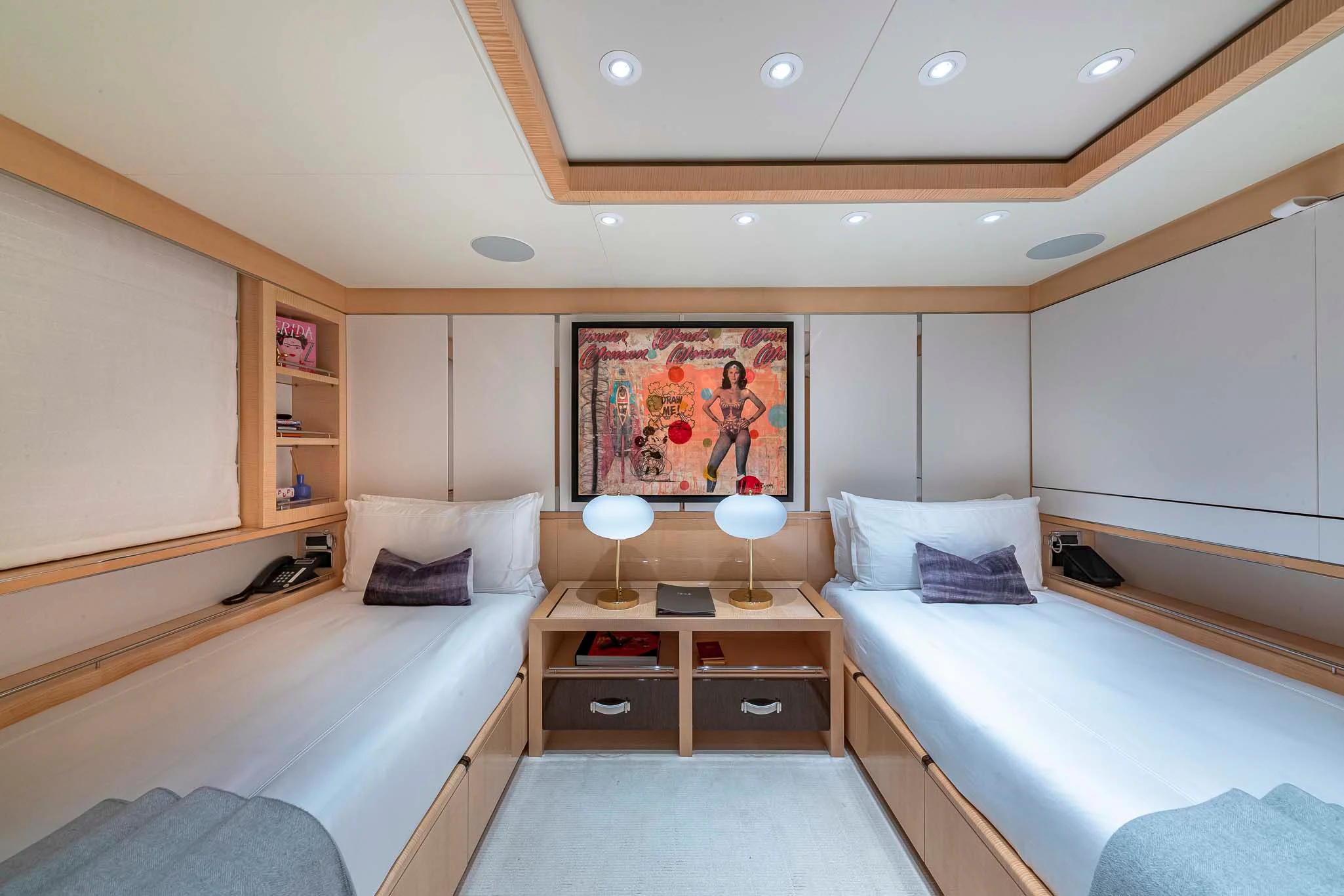 a room with a bed and a desk aboard REVELRY Yacht for Sale