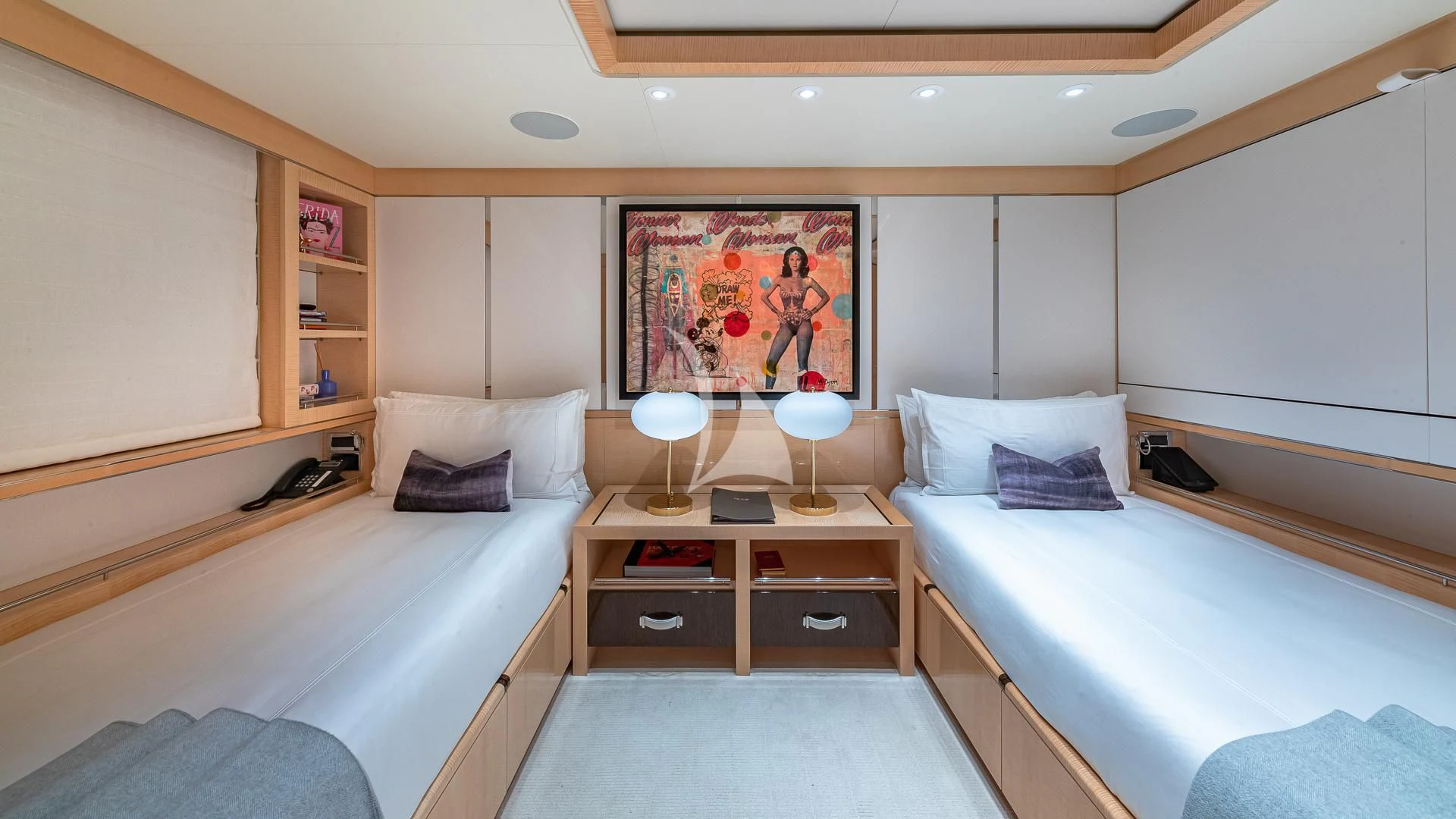 a room with a bed and a desk aboard REVELRY Yacht for Sale