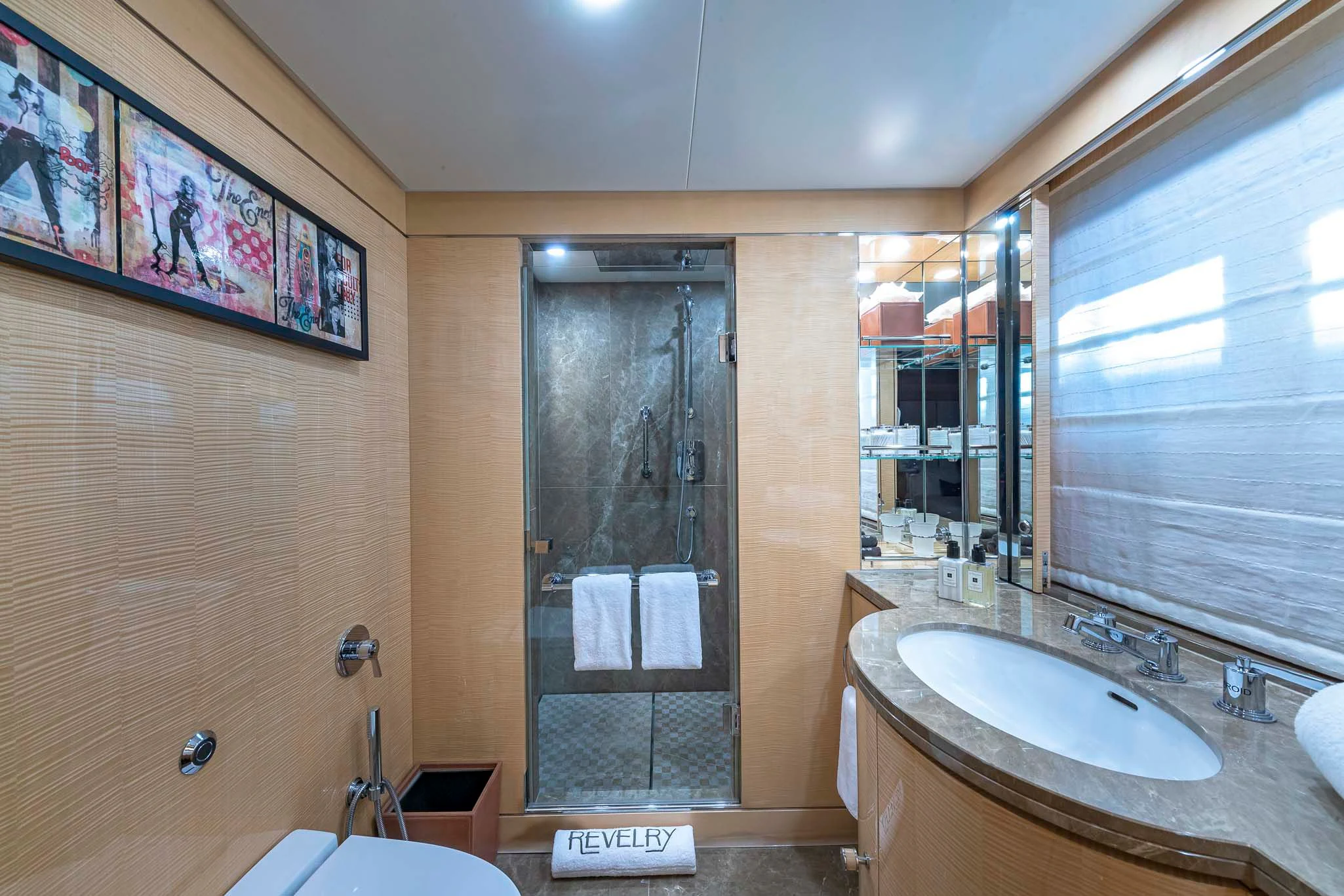 a bathroom with a sink and a shower aboard REVELRY Yacht for Sale