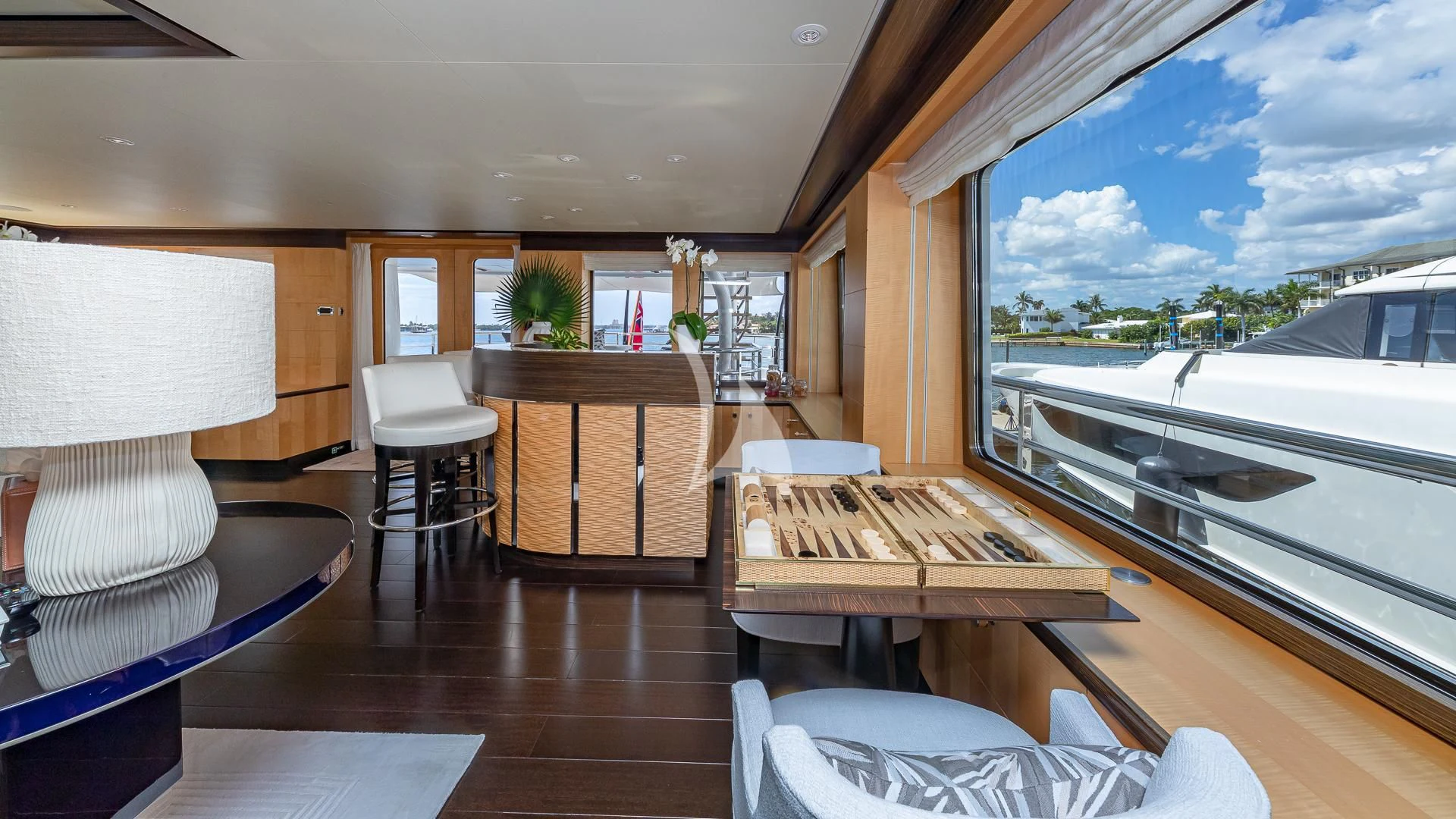 a room with a table and chairs aboard REVELRY Yacht for Sale