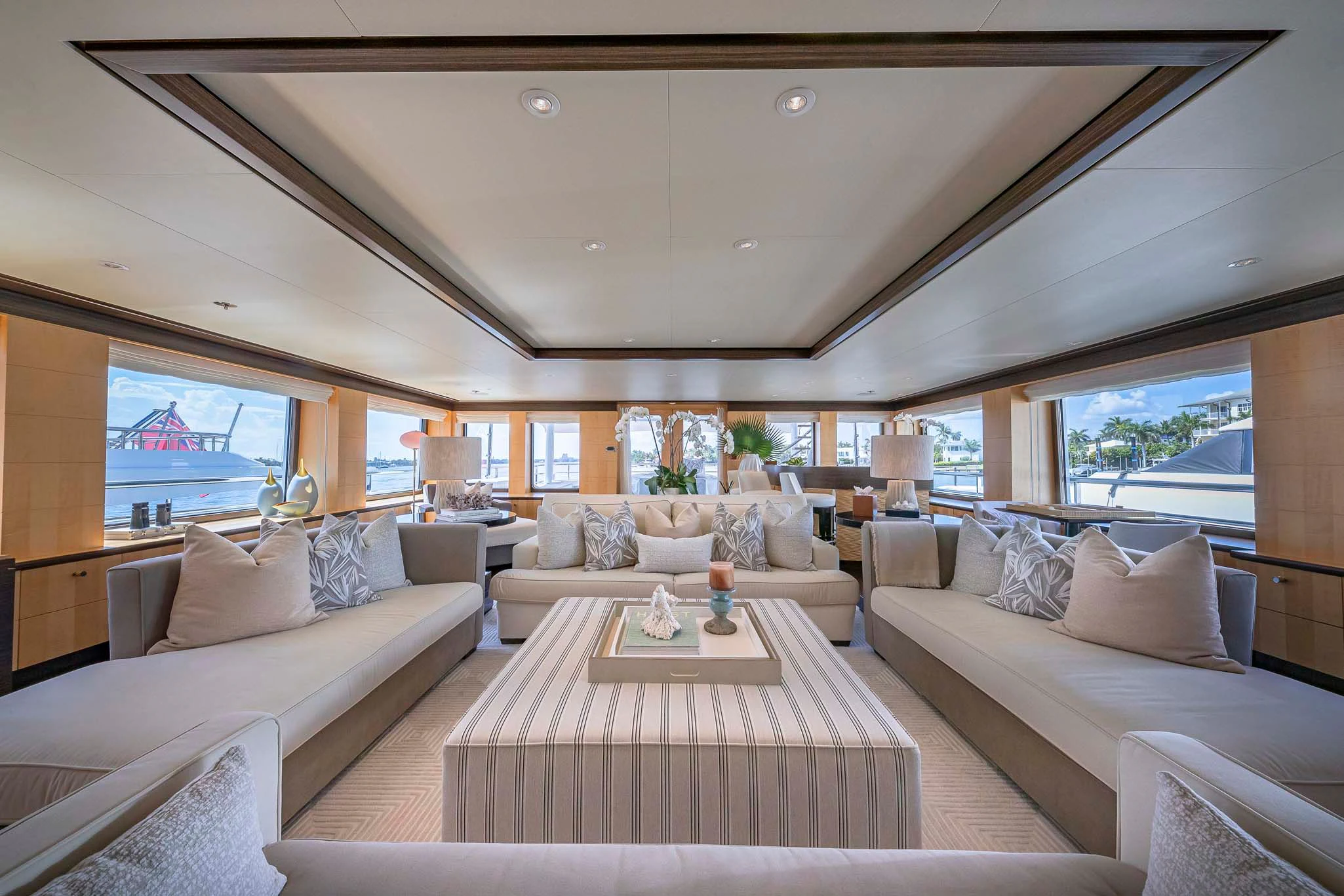 a living room with a large window aboard REVELRY Yacht for Sale