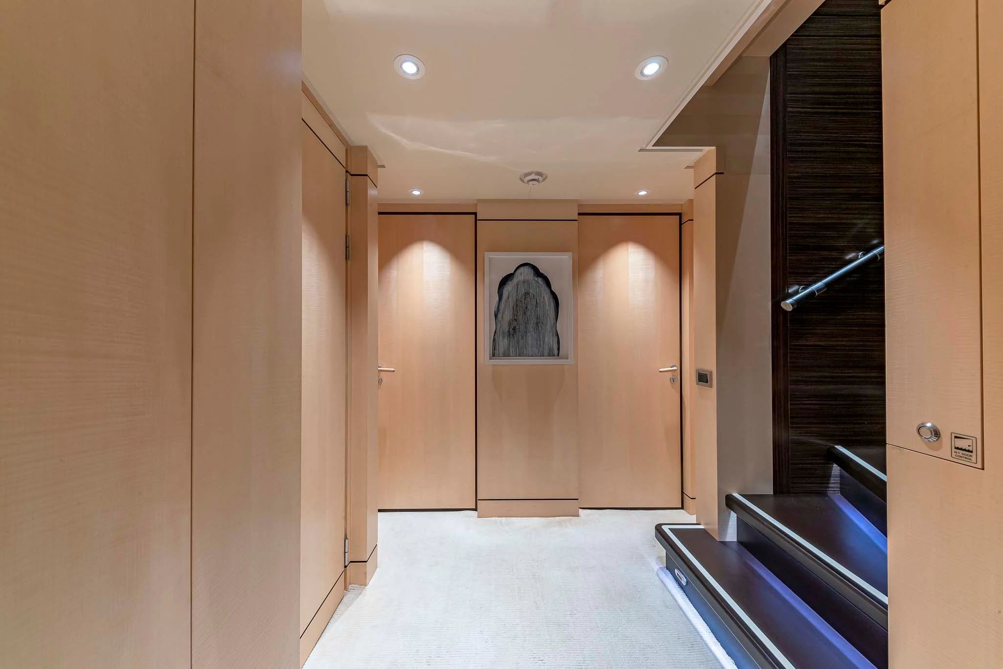 a hallway with doors aboard REVELRY Yacht for Sale