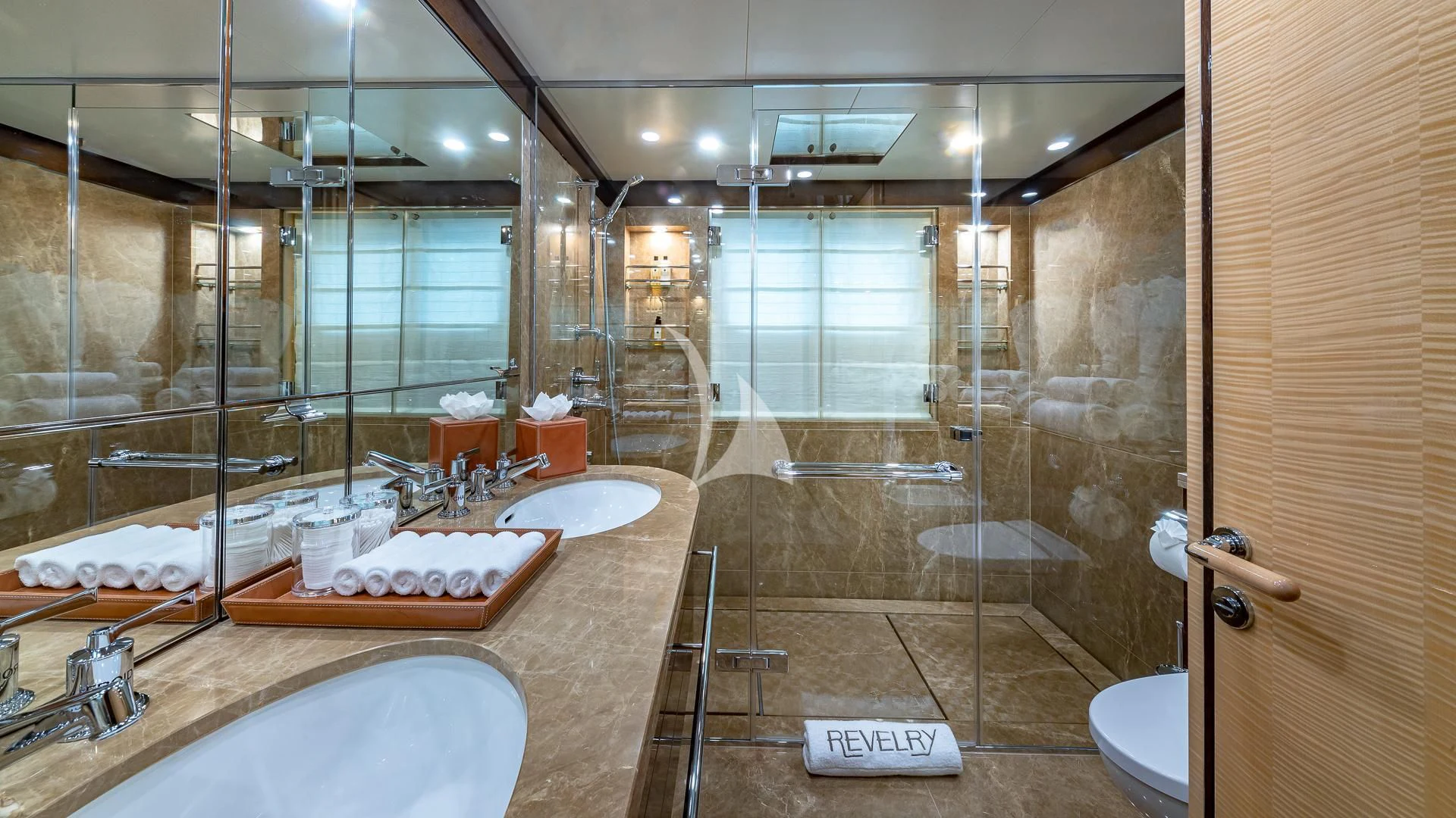 a bathroom with a large glass shower aboard REVELRY Yacht for Sale