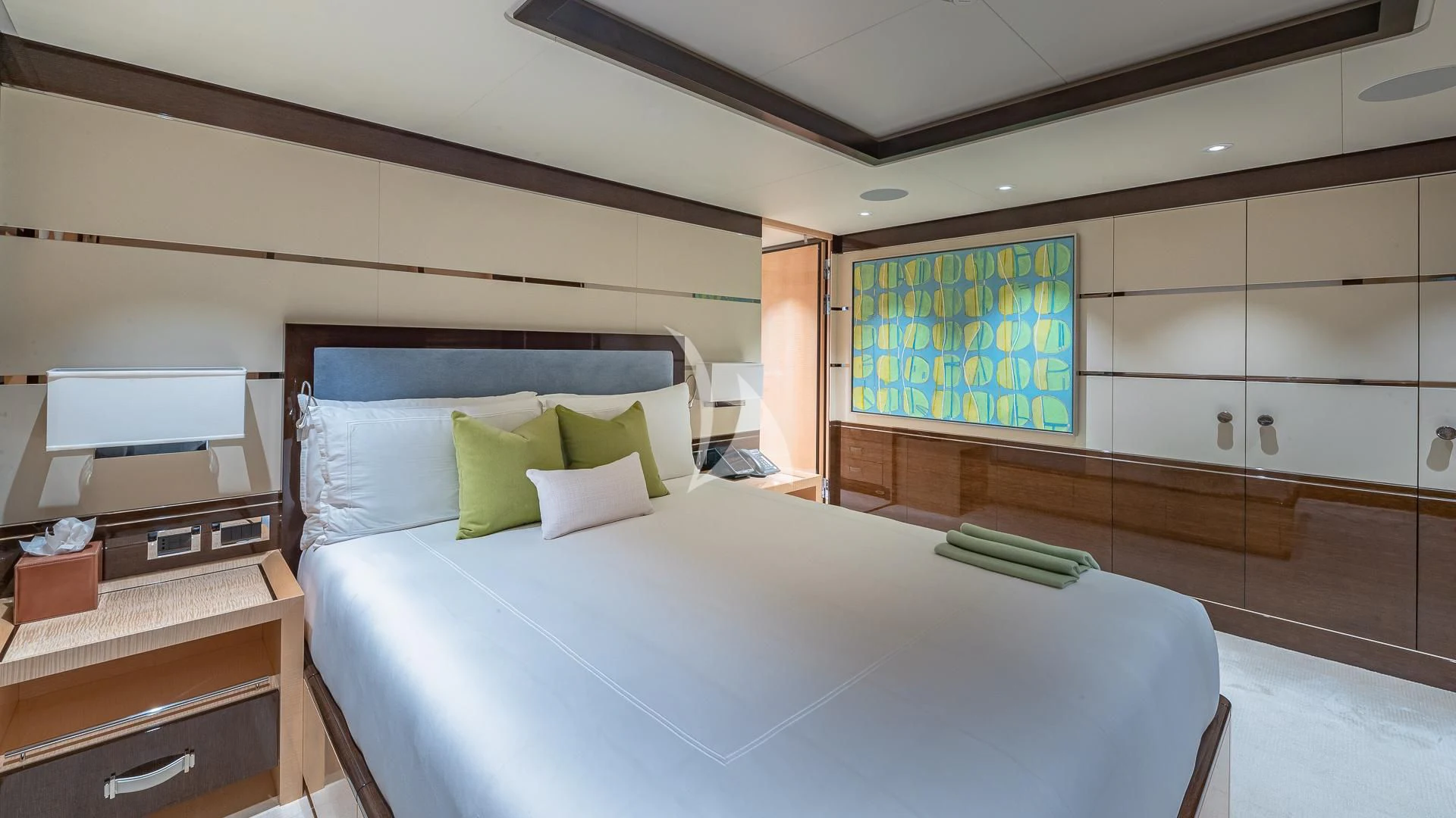 a room with a bed and a desk aboard REVELRY Yacht for Sale