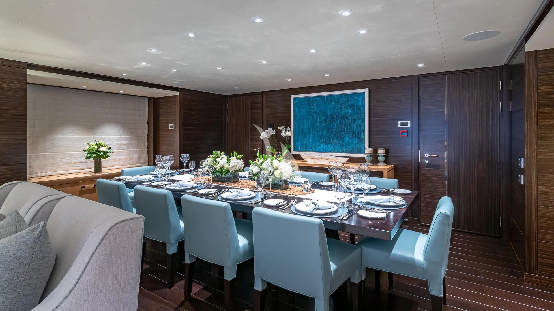 a large conference room with tables and chairs aboard REVELRY Yacht for Sale