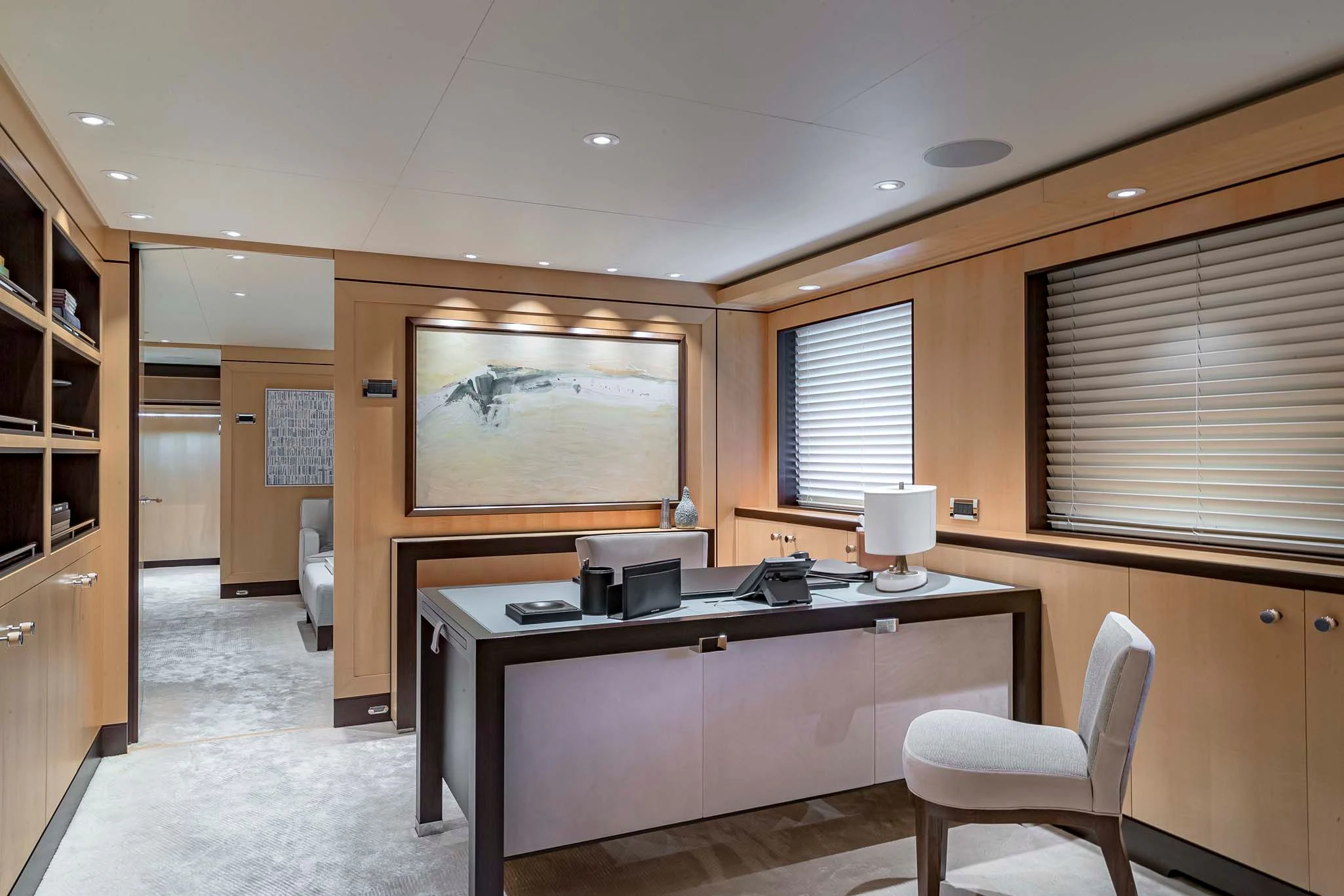 a large room with a desk and chairs aboard REVELRY Yacht for Sale