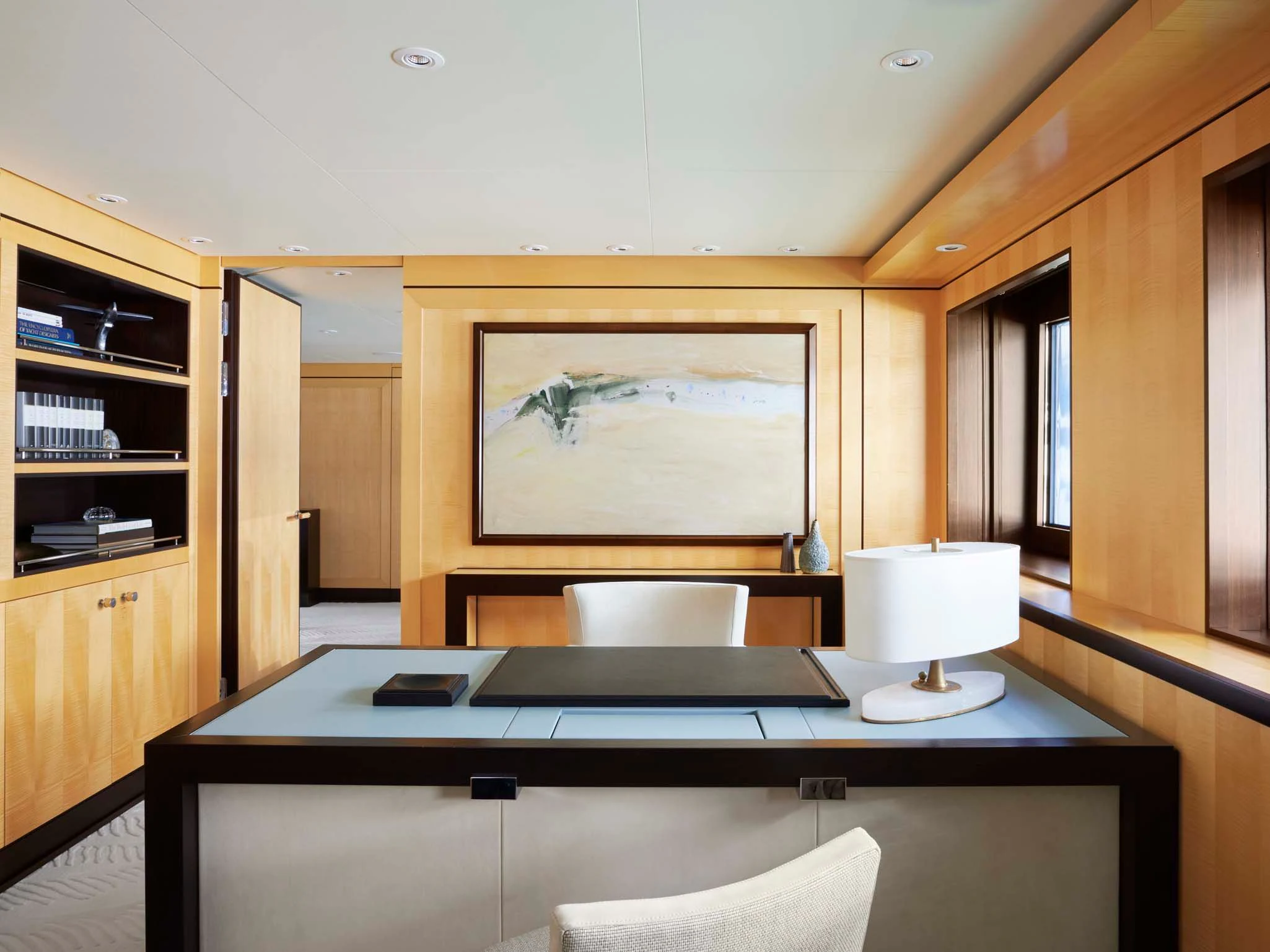 a room with a desk and a chair aboard REVELRY Yacht for Sale