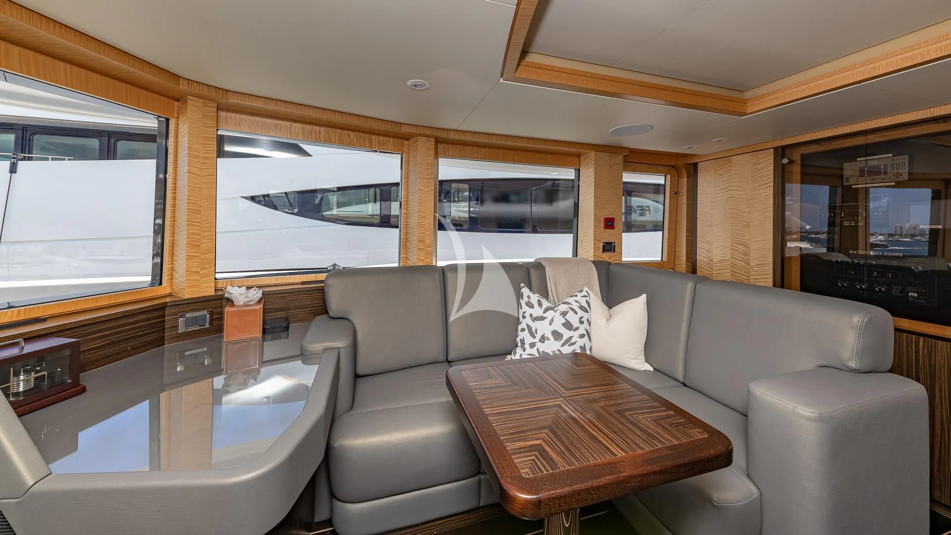 a living room with a couch and a table aboard REVELRY Yacht for Sale