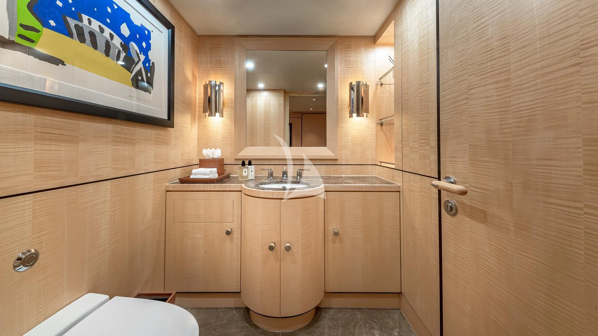 a bathroom with wooden cabinets aboard REVELRY Yacht for Sale