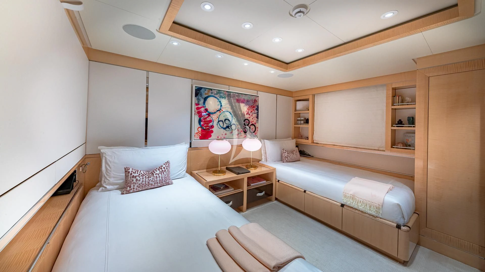 a room with two beds aboard REVELRY Yacht for Sale