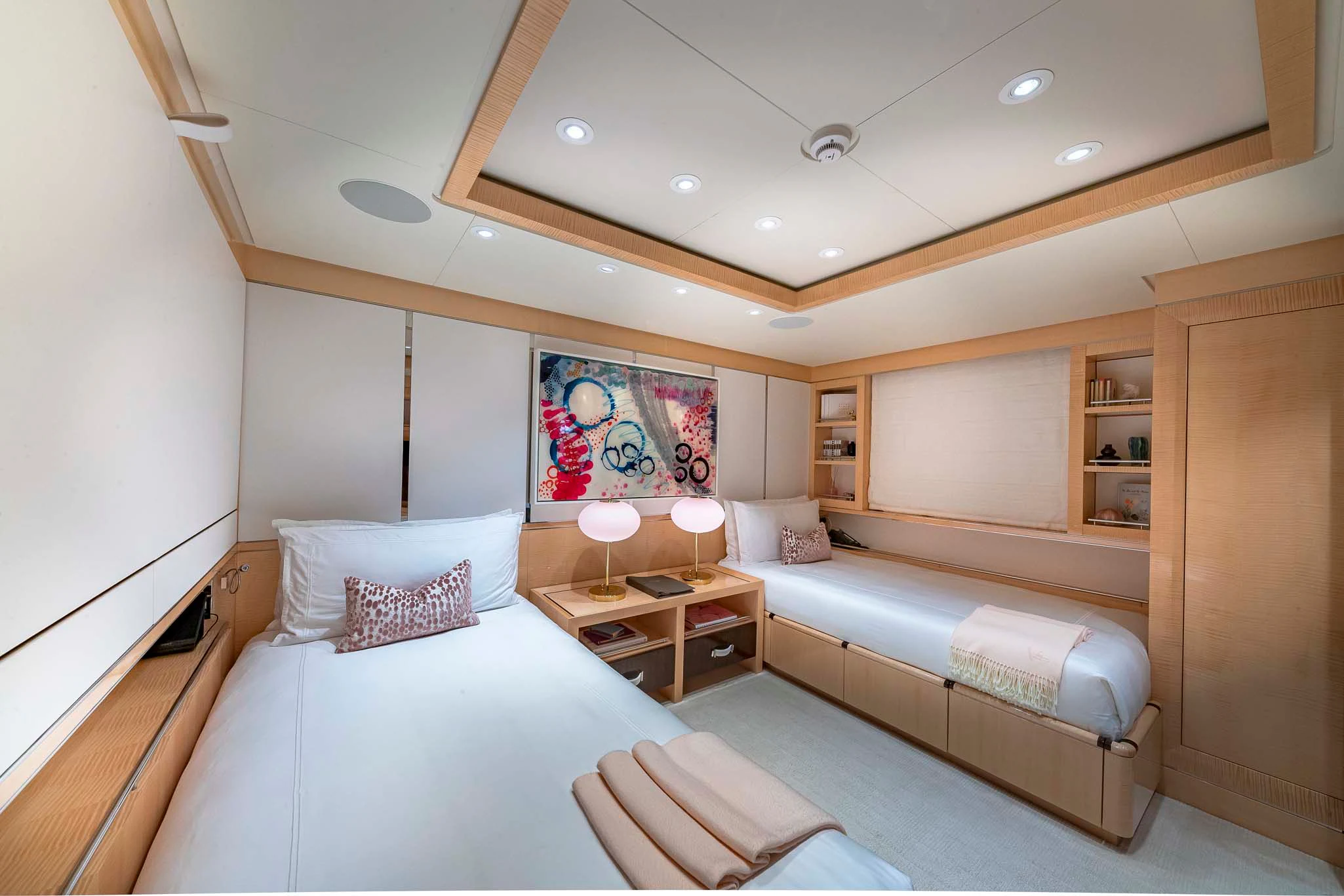 a room with two beds aboard REVELRY Yacht for Sale