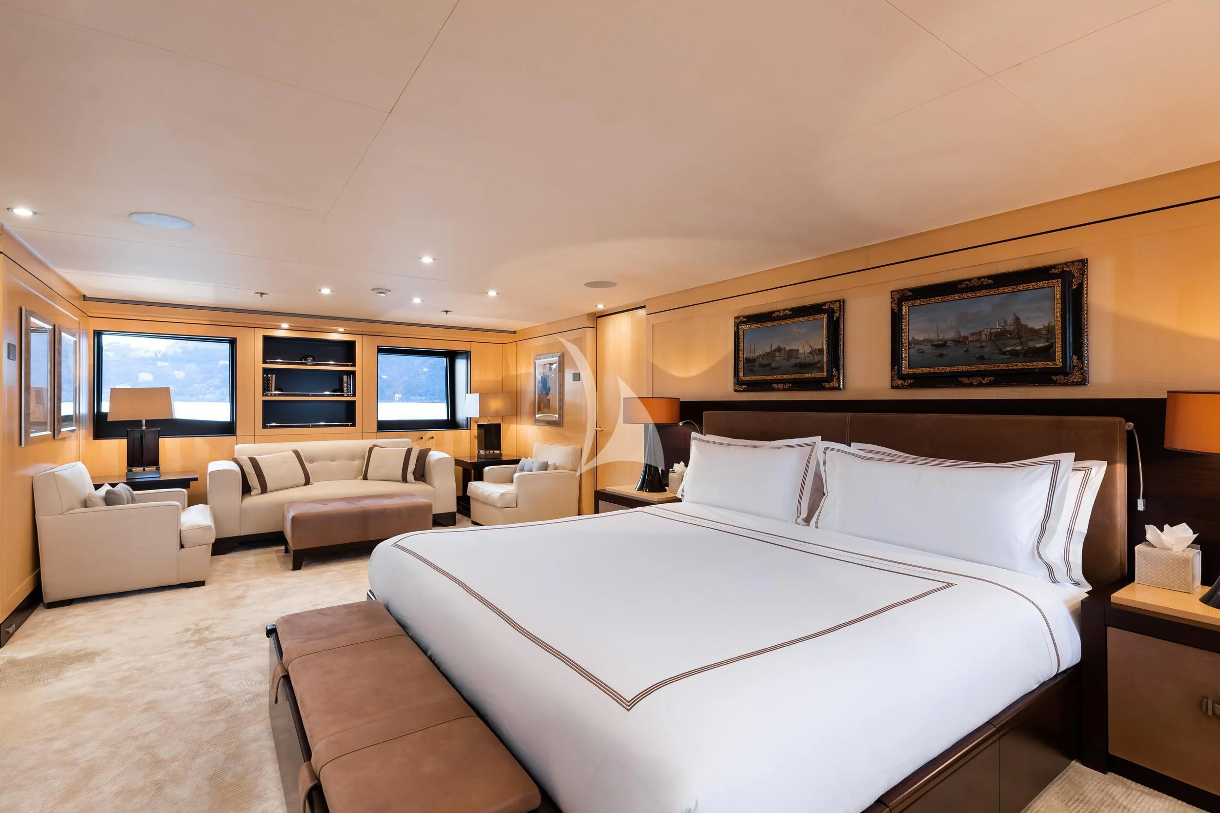a large hotel room with a large bed and a couch aboard REVELRY Yacht for Sale