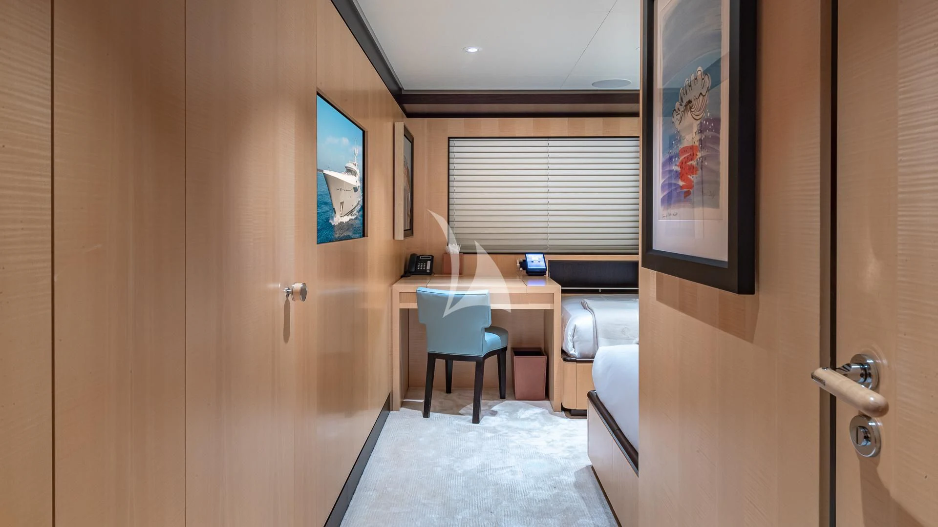 a room with a desk and a chair aboard REVELRY Yacht for Sale