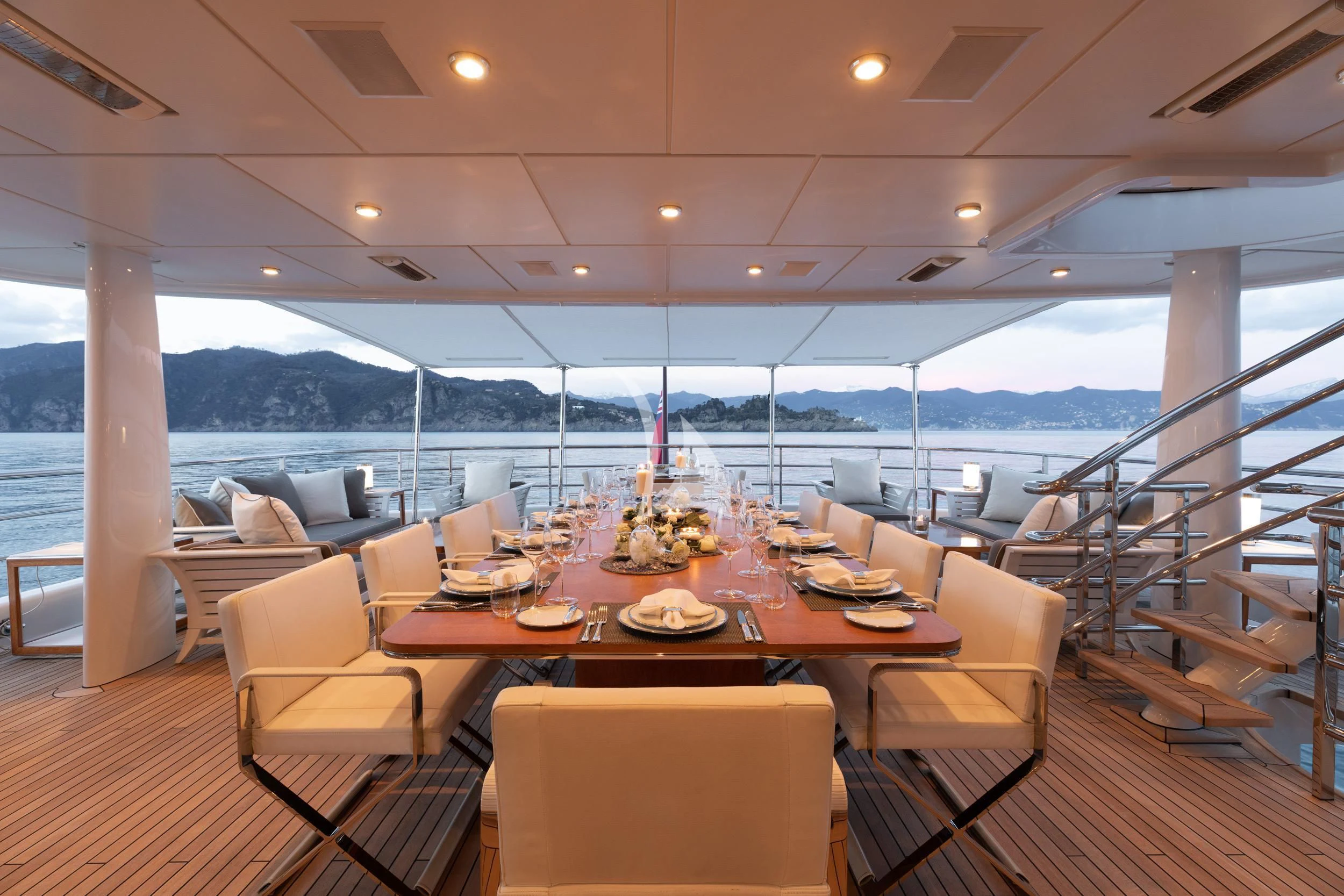 a dining room with a large table and chairs aboard REVELRY Yacht for Sale