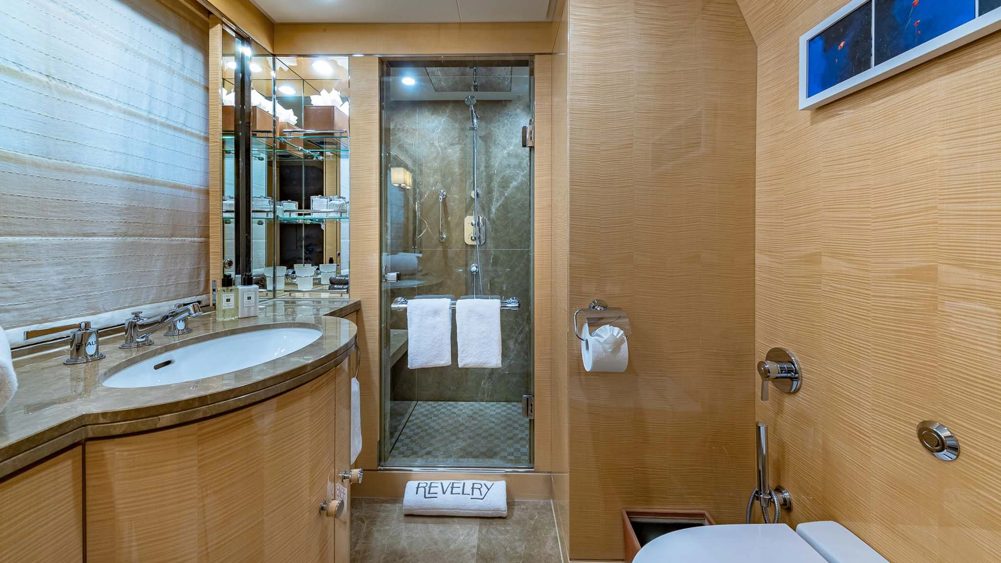 a bathroom with a glass shower aboard REVELRY Yacht for Sale