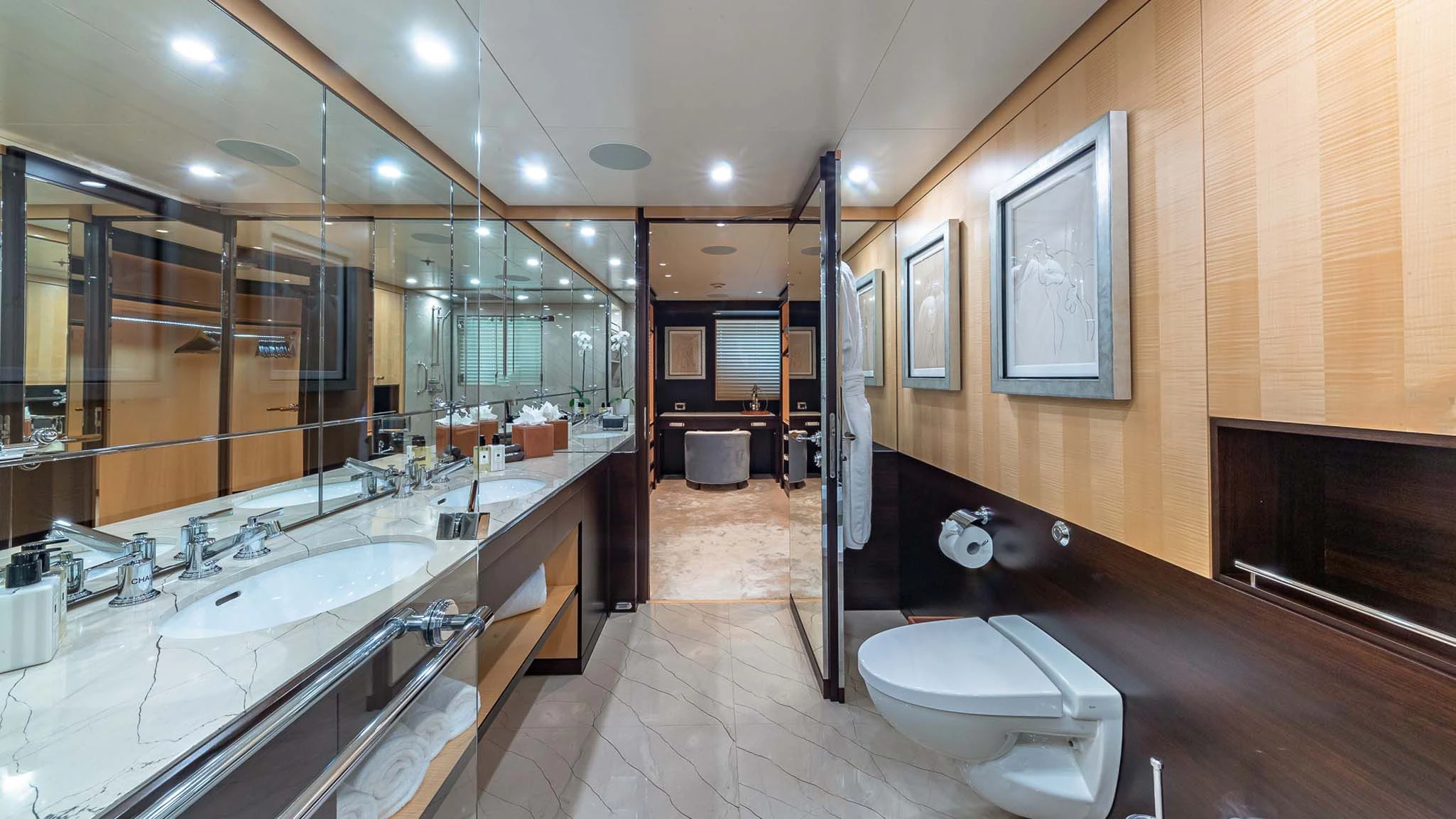 a bathroom with a large mirror aboard REVELRY Yacht for Sale