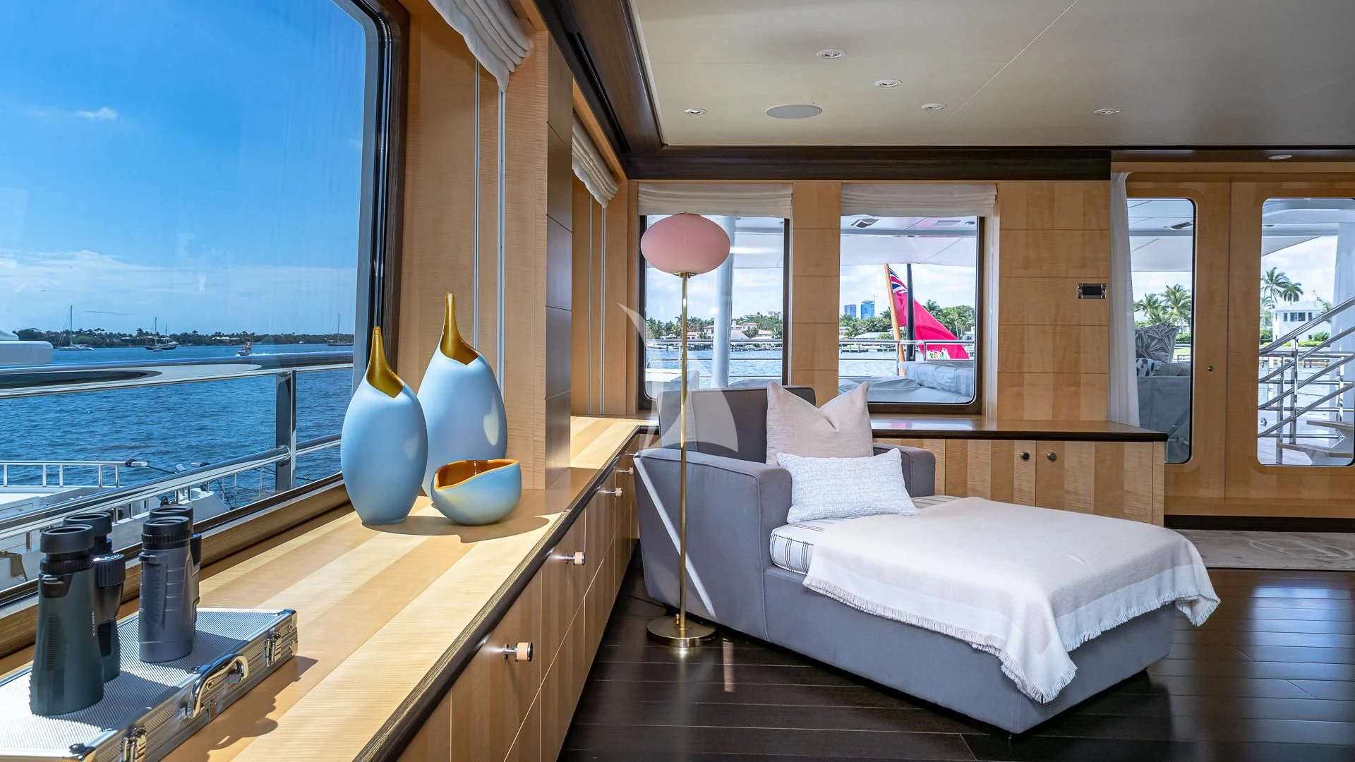 a room with a bed and a window aboard REVELRY Yacht for Sale