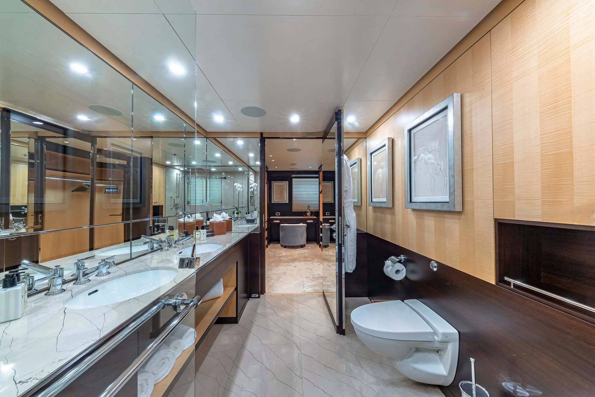 a bathroom with a large mirror aboard REVELRY Yacht for Sale