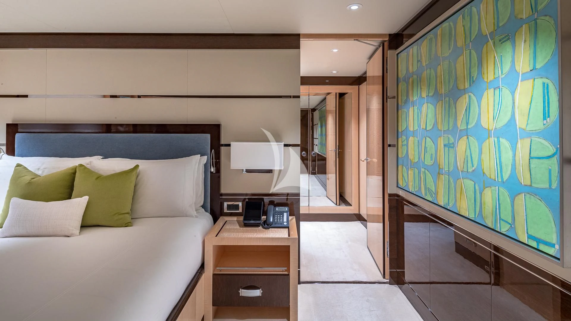 a bedroom with a bed and a desk aboard REVELRY Yacht for Sale
