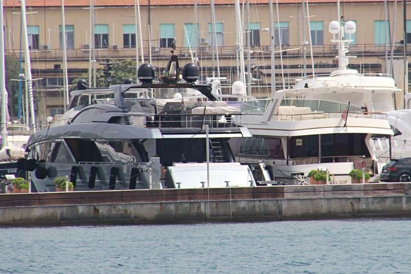 a boat docked at a pier aboard YOYITA II Yacht for Sale