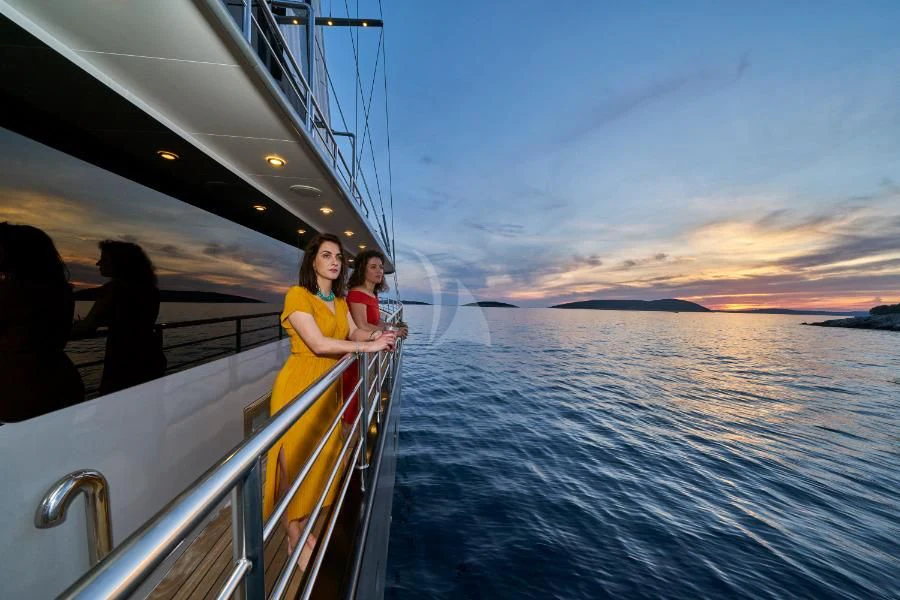 a man and a child on a boat aboard RARA AVIS Yacht for Charter
