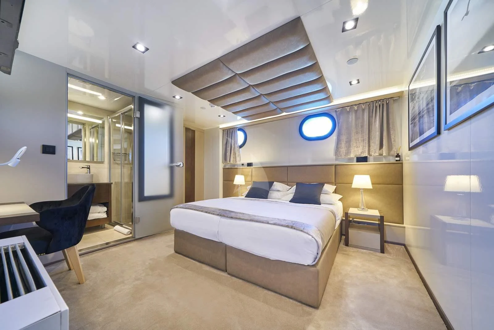 a bedroom with a bed and a chair aboard RARA AVIS Yacht for Charter