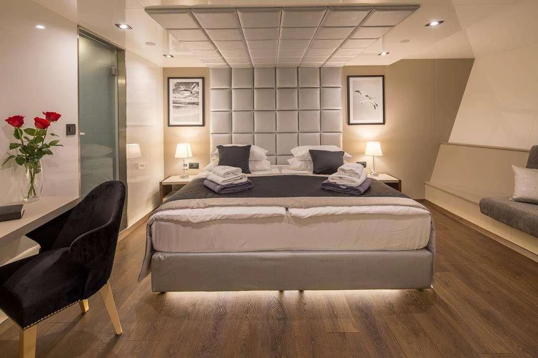 a bed in a hotel room aboard RARA AVIS Yacht for Charter