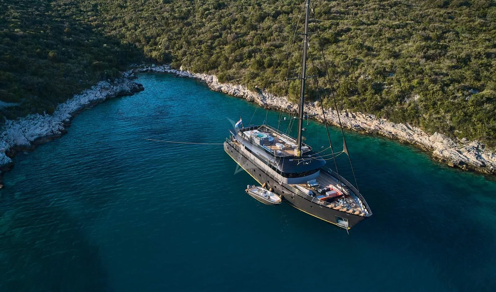 a boat sailing on the water aboard RARA AVIS Yacht for Charter