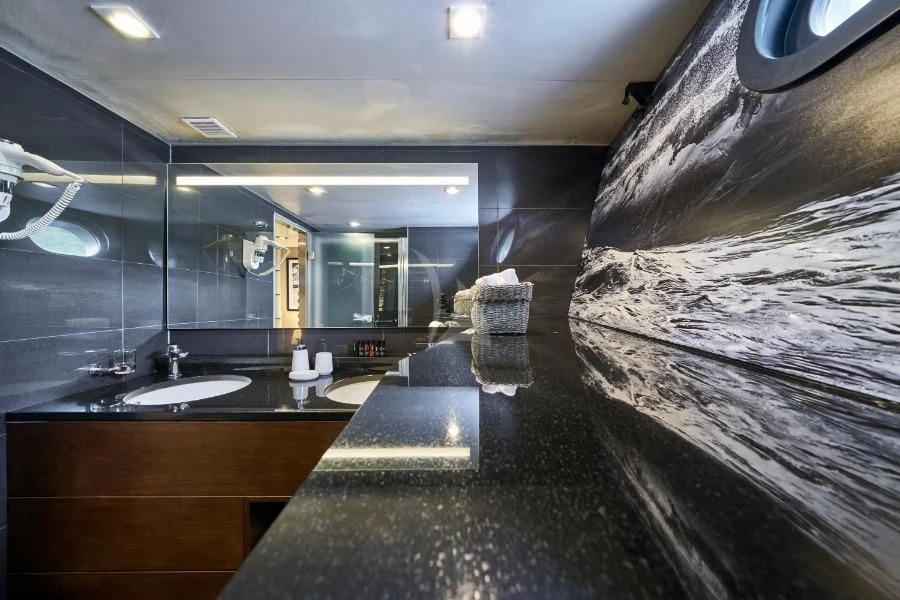 a bathroom with a large mirror aboard RARA AVIS Yacht for Charter