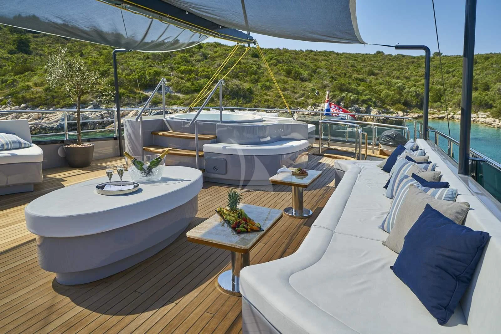 a deck with a table and chairs aboard RARA AVIS Yacht for Charter