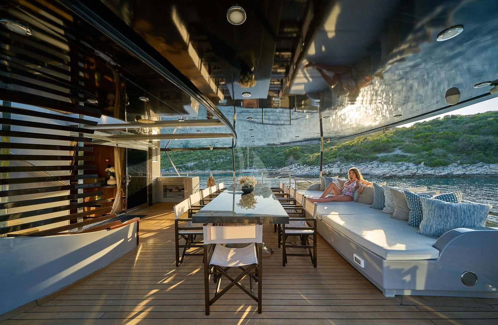 a person sitting on a couch aboard RARA AVIS Yacht for Charter