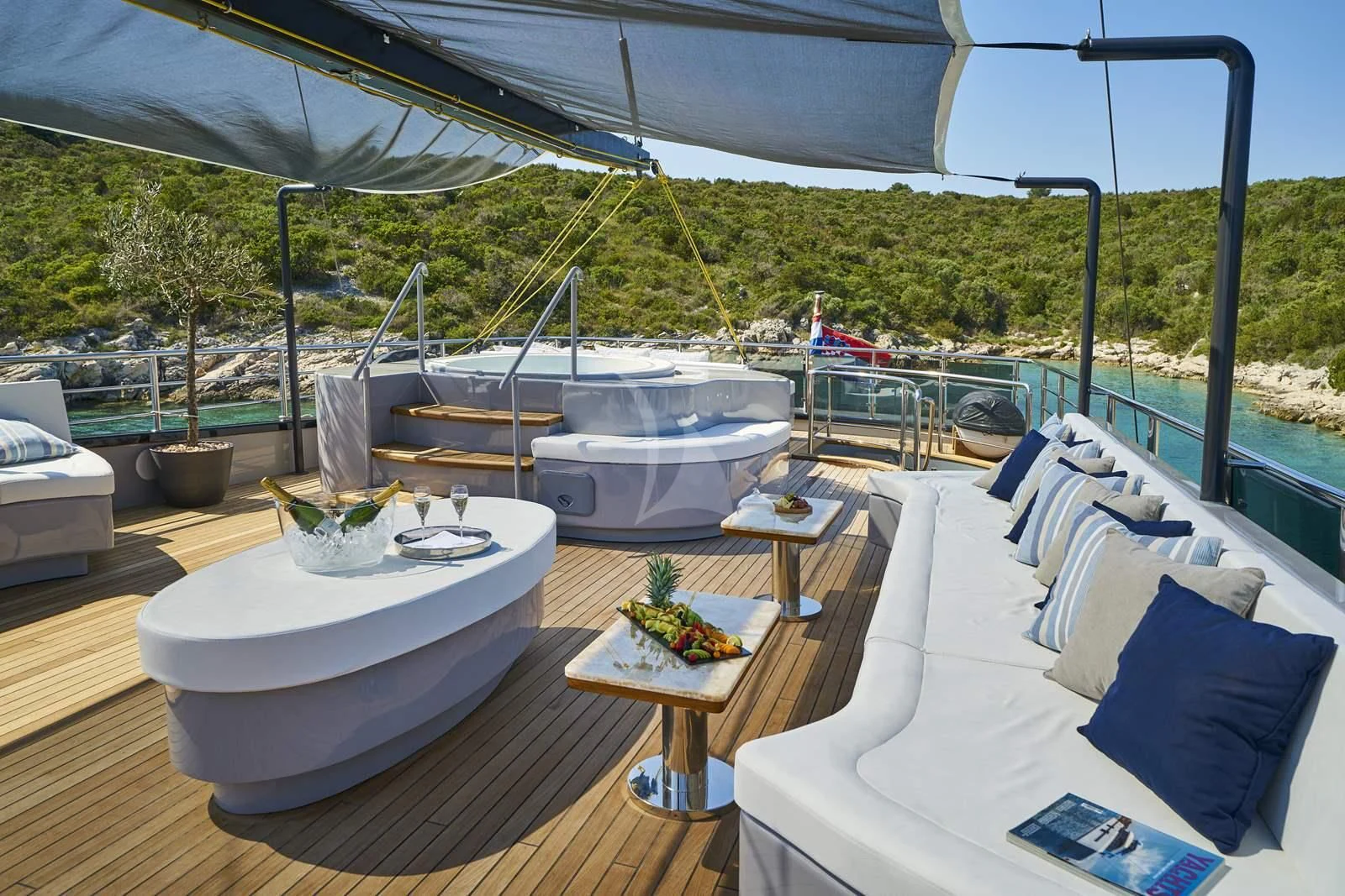 a patio with a table and chairs aboard RARA AVIS Yacht for Charter