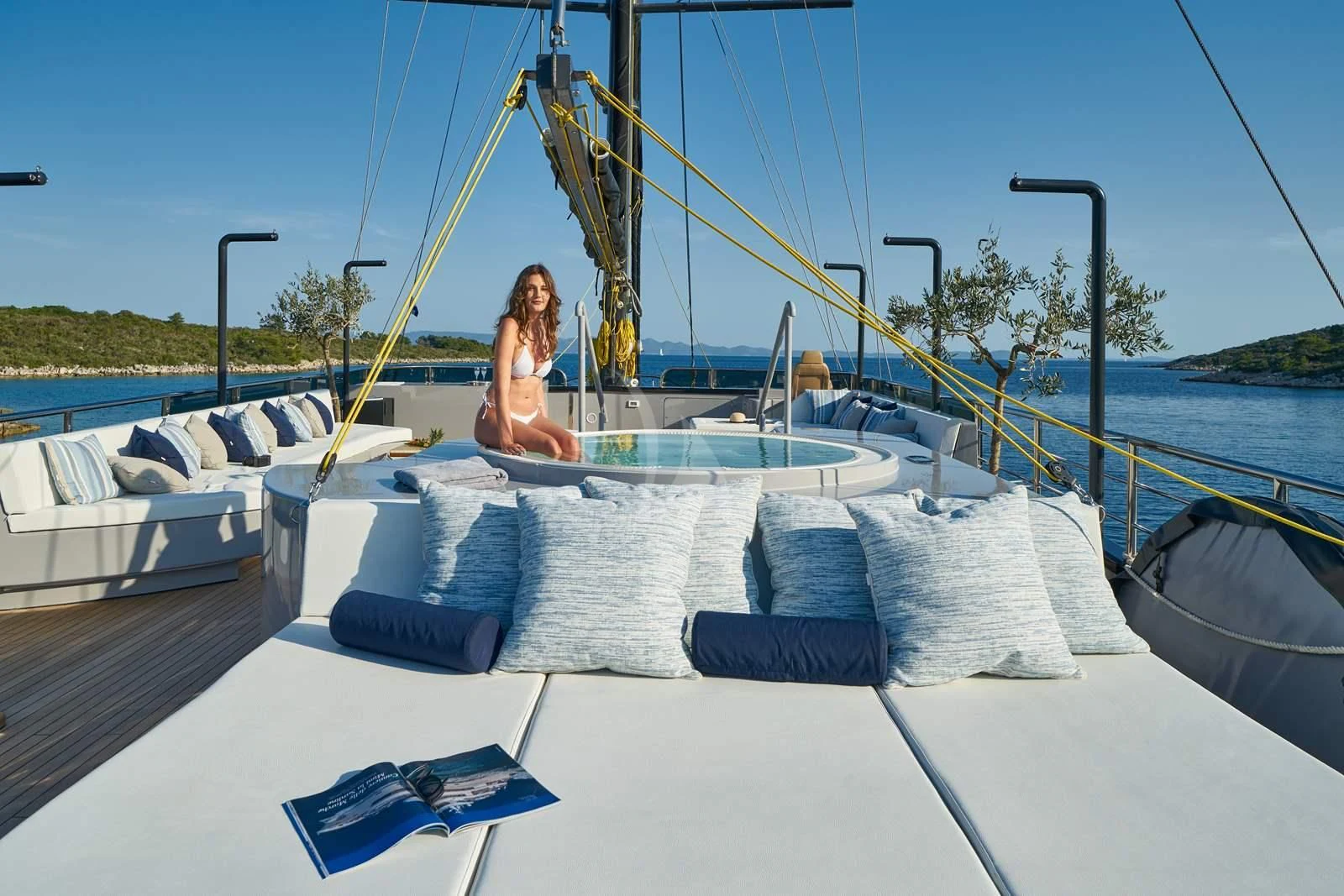 a person sitting on a boat aboard RARA AVIS Yacht for Charter