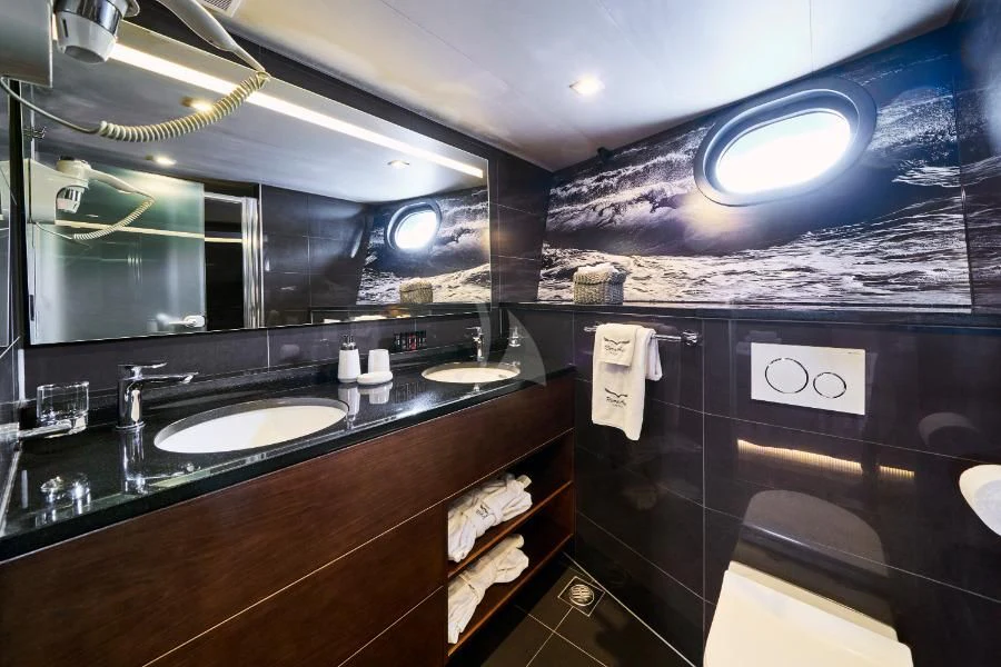 a bathroom with sinks and mirrors aboard RARA AVIS Yacht for Charter