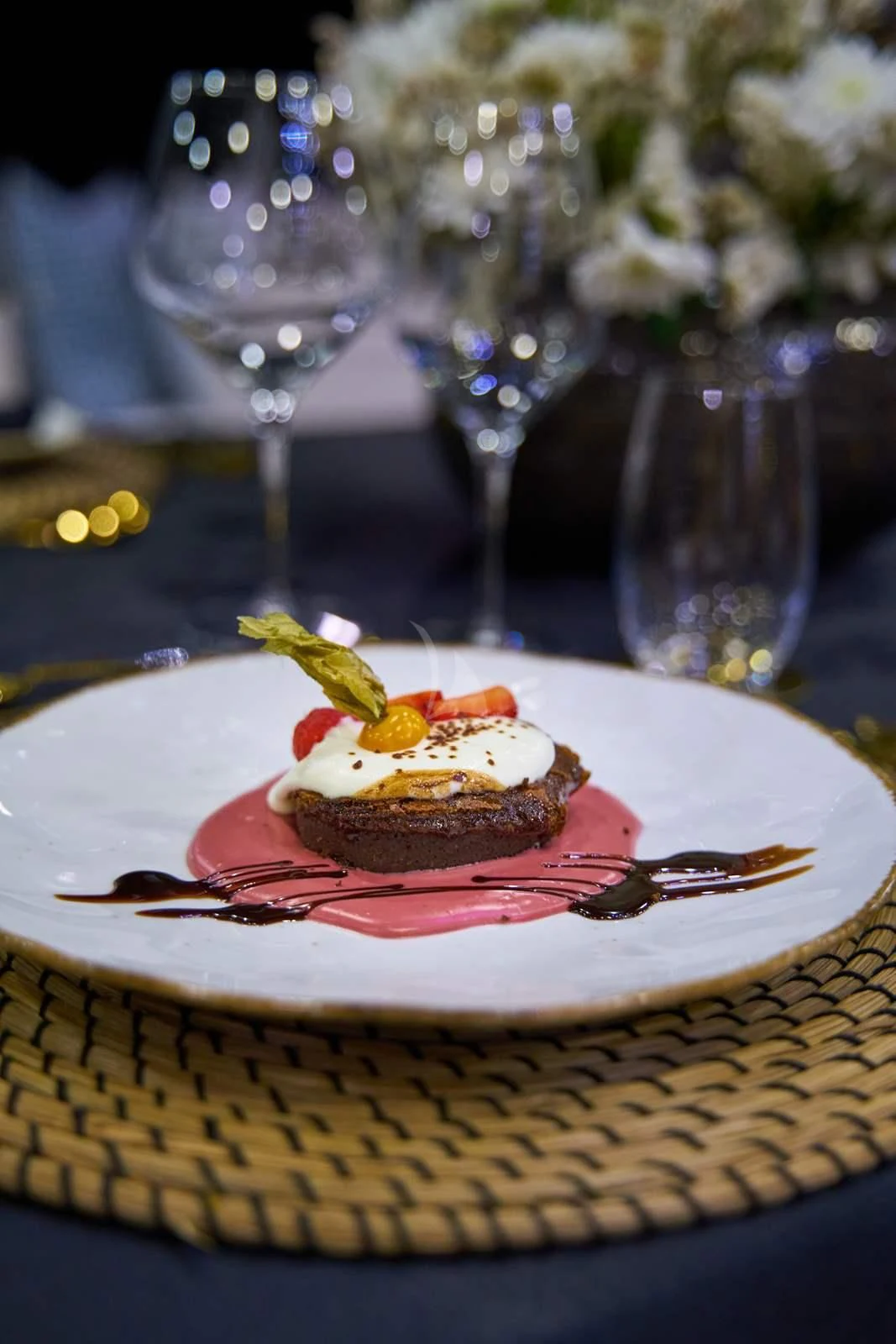 a plate of dessert and glasses aboard RARA AVIS Yacht for Charter