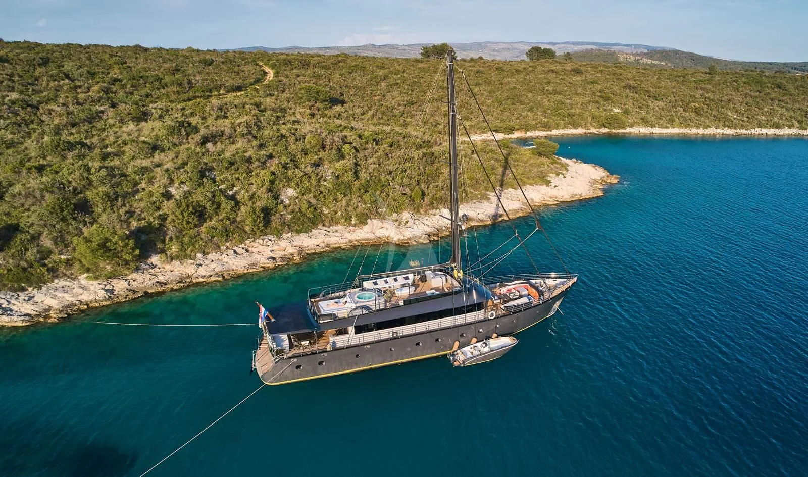a boat sailing on the water aboard RARA AVIS Yacht for Charter