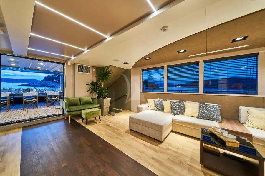 a living room with a large window aboard RARA AVIS Yacht for Charter
