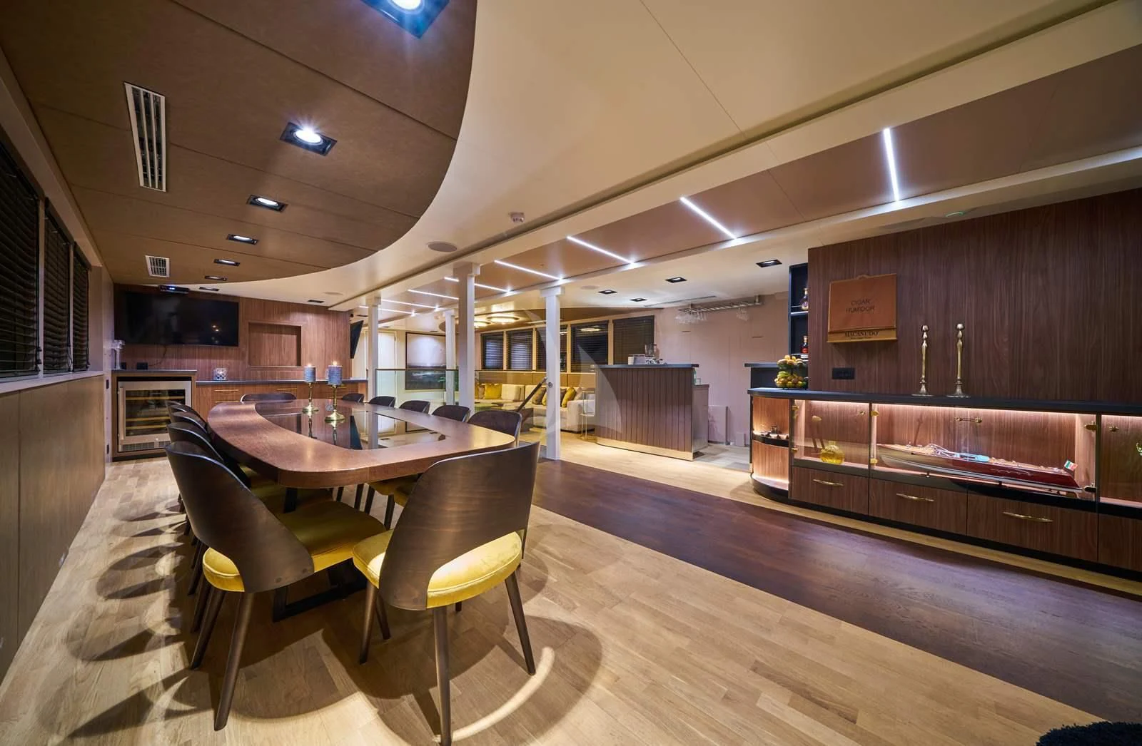 a room with a table and chairs aboard RARA AVIS Yacht for Charter